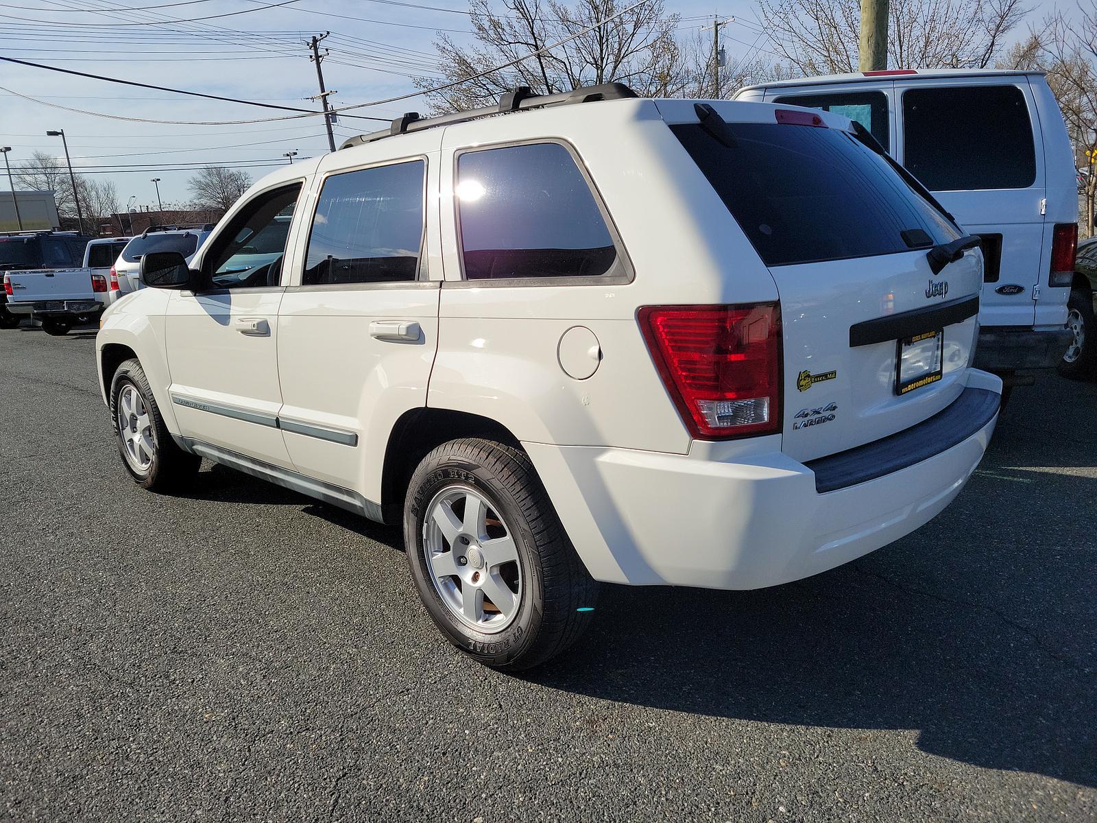 2009 Stone White - PW1 /Khaki - ELJ3 Jeep Grand Cherokee Laredo (1J8GR48K69C) with an 3.7L V6 ENGINE engine, located at 50 Eastern Blvd., Essex, MD, 21221, (410) 686-3444, 39.304367, -76.484947 - <p>Our incredible 2009 Jeep Grand Cherokee Laredo is shown off in Stone White. Powered by a strong 3.7 Liter V6 generating 210hp while connected to a durable 5 Speed Automatic transmission for easy passing. This Rear Wheel Drive SUV has plenty of power for both city traffic and swift highway cruisin - Photo #5