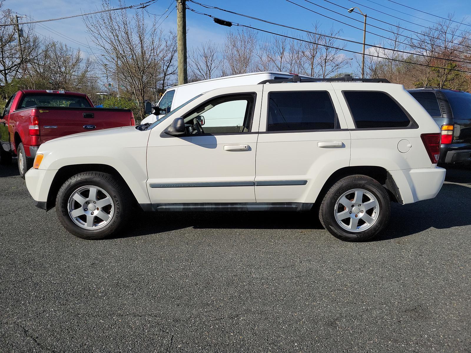 2009 Stone White - PW1 /Khaki - ELJ3 Jeep Grand Cherokee Laredo (1J8GR48K69C) with an 3.7L V6 ENGINE engine, located at 50 Eastern Blvd., Essex, MD, 21221, (410) 686-3444, 39.304367, -76.484947 - <p>Our incredible 2009 Jeep Grand Cherokee Laredo is shown off in Stone White. Powered by a strong 3.7 Liter V6 generating 210hp while connected to a durable 5 Speed Automatic transmission for easy passing. This Rear Wheel Drive SUV has plenty of power for both city traffic and swift highway cruisin - Photo #6