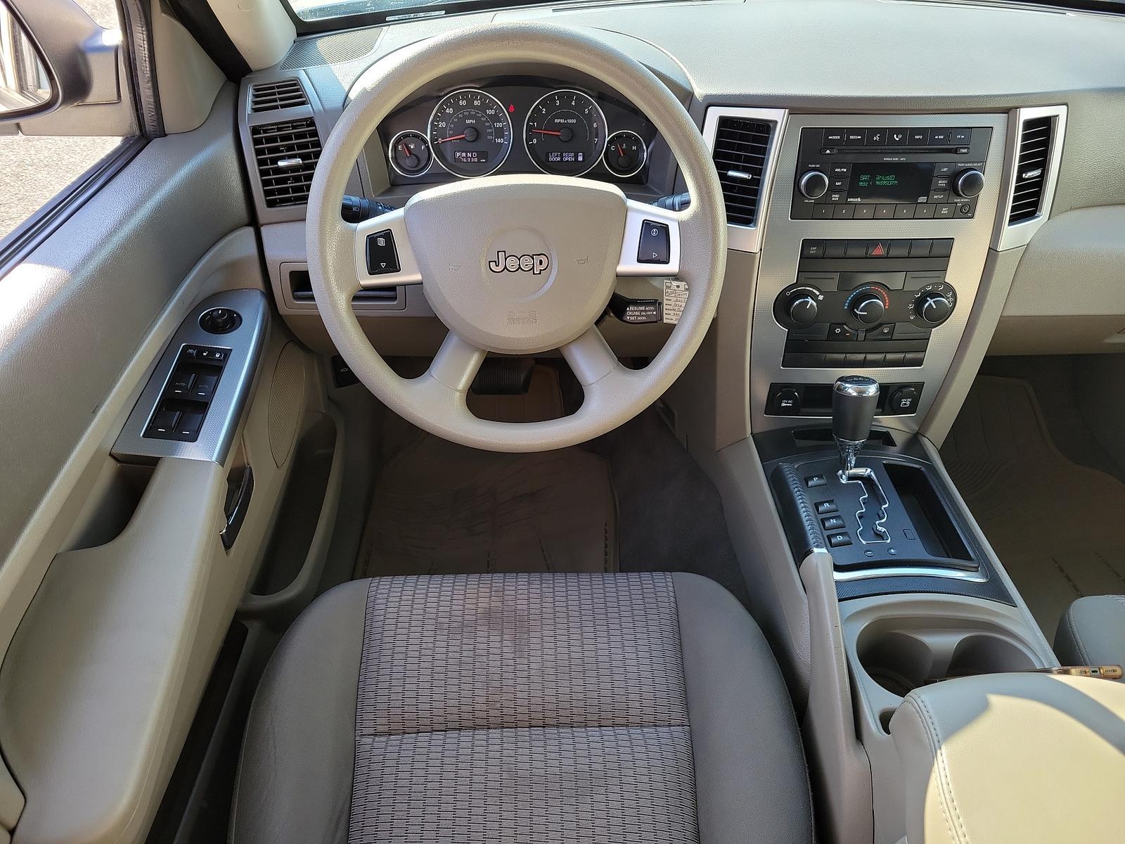 2009 Stone White - PW1 /Khaki - ELJ3 Jeep Grand Cherokee Laredo (1J8GR48K69C) with an 3.7L V6 ENGINE engine, located at 50 Eastern Blvd., Essex, MD, 21221, (410) 686-3444, 39.304367, -76.484947 - <p>Our incredible 2009 Jeep Grand Cherokee Laredo is shown off in Stone White. Powered by a strong 3.7 Liter V6 generating 210hp while connected to a durable 5 Speed Automatic transmission for easy passing. This Rear Wheel Drive SUV has plenty of power for both city traffic and swift highway cruisin - Photo #10