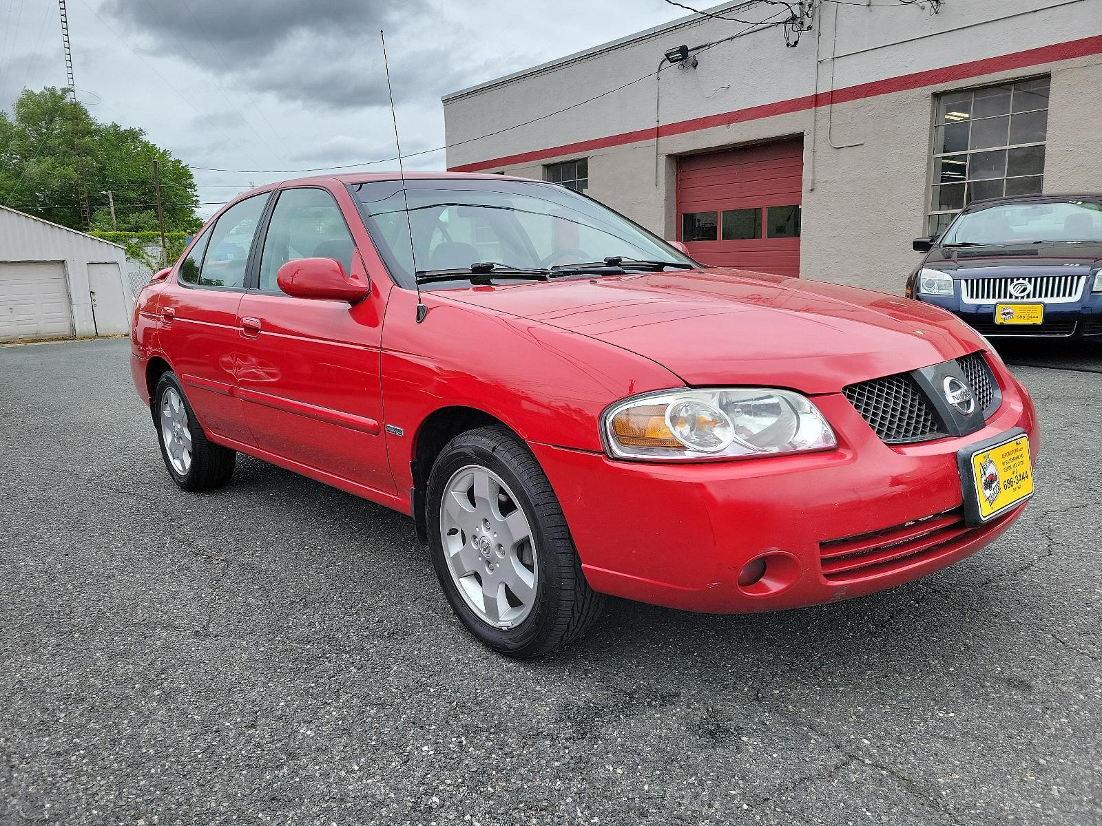 2006 Code Red - A20 /Charcoal - G Nissan Sentra 1.8 S (3N1CB51D06L) with an 1.8L SMPI DOHC 16-valve 4-cyl engine engine, located at 50 Eastern Blvd., Essex, MD, 21221, (410) 686-3444, 39.304367, -76.484947 - <p>Meet our 2006 Nissan Sentra S Sedan that looks sleek in Code Red! Powered by a 1.8 Liter 4 Cylinder generating 126hp connected to the 4 Speed Automatic transmission. This Front Wheel Drive sedan was built to perform while earning up to 34mpg on the highway! The exterior of our Sentra stands out w - Photo #2