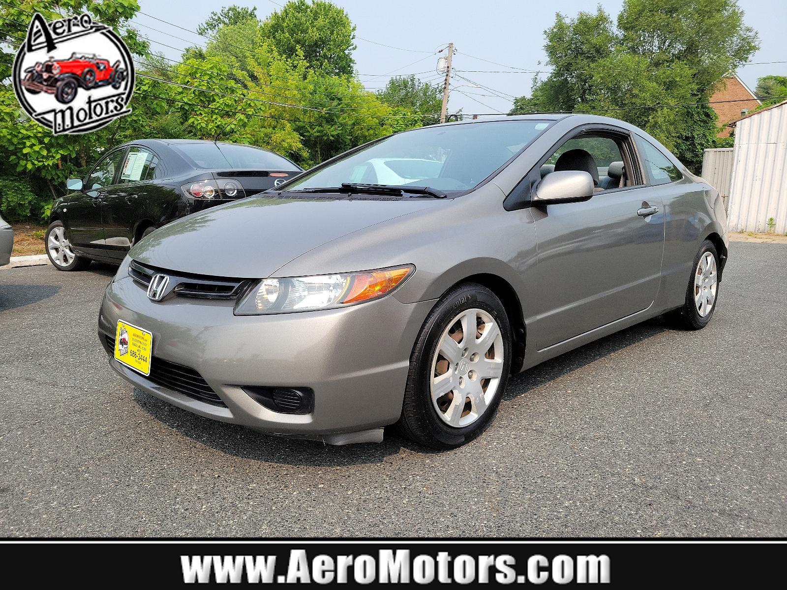 2007 Galaxy Gray Metallic - GY /Gray - GR Honda Civic Cpe LX (2HGFG11657H) with an 1.8L SOHC MPFI 16-valve i-VTEC I4 engine engine, located at 50 Eastern Blvd., Essex, MD, 21221, (410) 686-3444, 39.304367, -76.484947 - <p>Our 2007 Honda Civic LX Sedan in Alabaster Silver Metallic retains the efficient, economic design and quality components that have made it one of the world's most popular and successful compact cars! Power comes from a 1.8 Liter 4 Cylinder generating 140hp while paired to a smooth-shifting 5 Spee - Photo #0