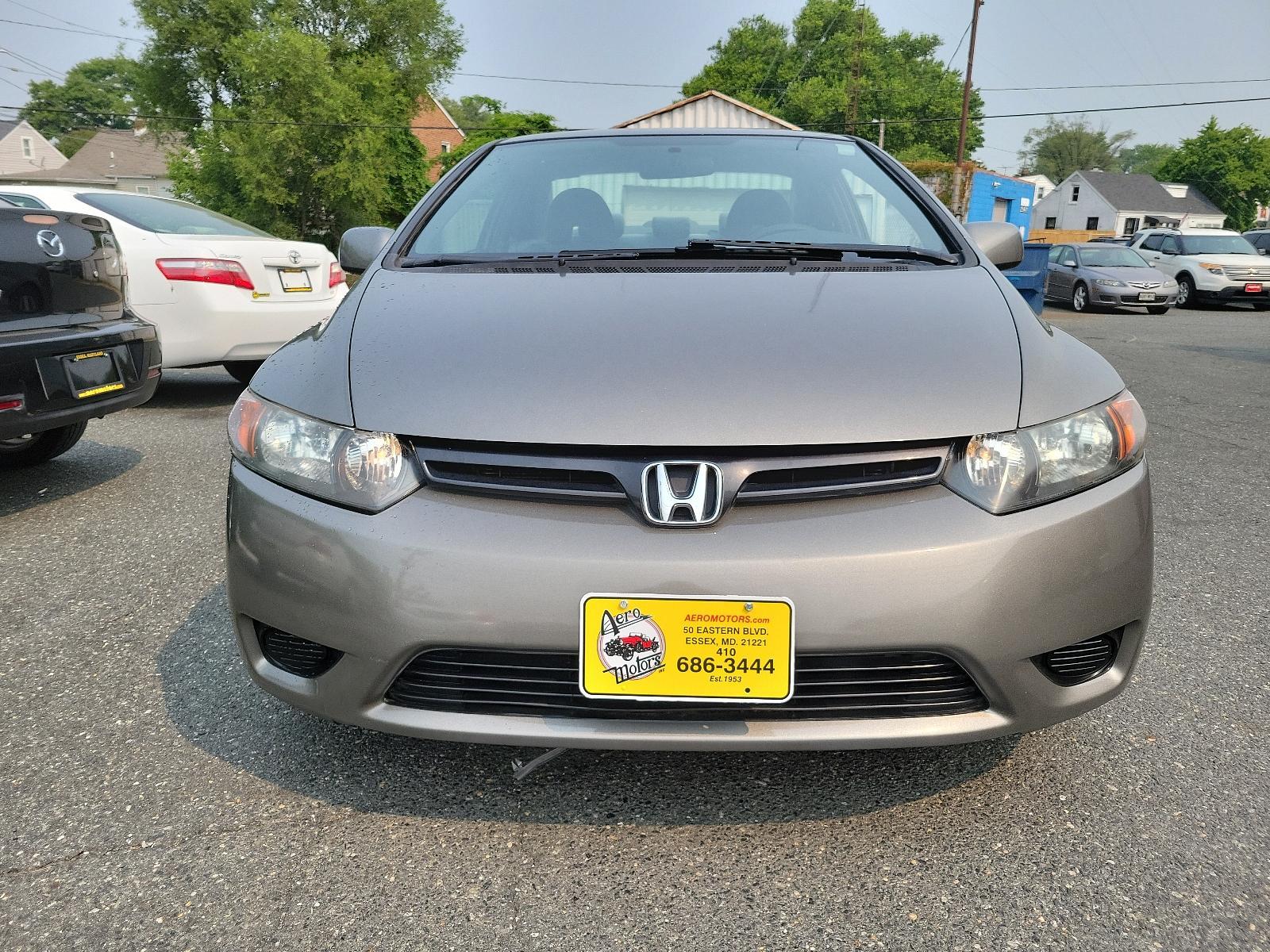 2007 Galaxy Gray Metallic - GY /Gray - GR Honda Civic Cpe LX (2HGFG11657H) with an 1.8L SOHC MPFI 16-valve i-VTEC I4 engine engine, located at 50 Eastern Blvd., Essex, MD, 21221, (410) 686-3444, 39.304367, -76.484947 - <p>Our 2007 Honda Civic LX Sedan in Alabaster Silver Metallic retains the efficient, economic design and quality components that have made it one of the world's most popular and successful compact cars! Power comes from a 1.8 Liter 4 Cylinder generating 140hp while paired to a smooth-shifting 5 Spee - Photo #1