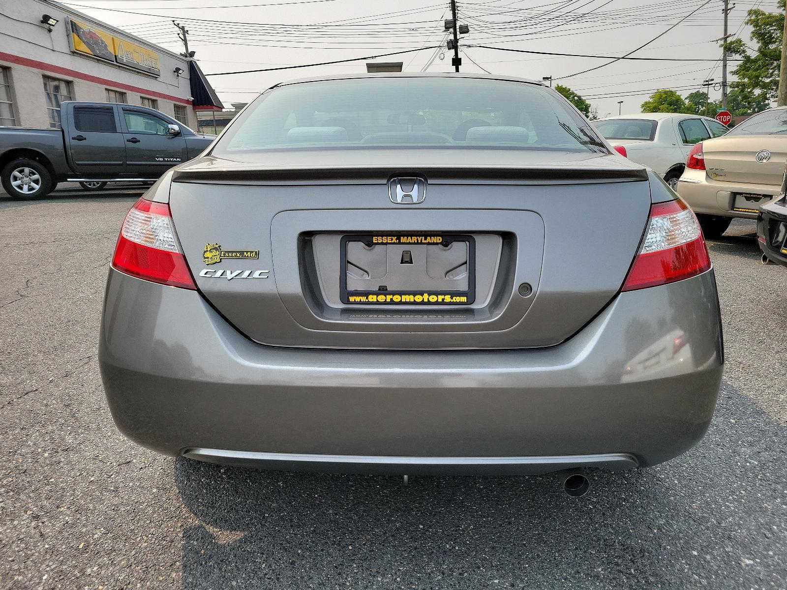 2007 Galaxy Gray Metallic - GY /Gray - GR Honda Civic Cpe LX (2HGFG11657H) with an 1.8L SOHC MPFI 16-valve i-VTEC I4 engine engine, located at 50 Eastern Blvd., Essex, MD, 21221, (410) 686-3444, 39.304367, -76.484947 - <p>Our 2007 Honda Civic LX Sedan in Alabaster Silver Metallic retains the efficient, economic design and quality components that have made it one of the world's most popular and successful compact cars! Power comes from a 1.8 Liter 4 Cylinder generating 140hp while paired to a smooth-shifting 5 Spee - Photo #4