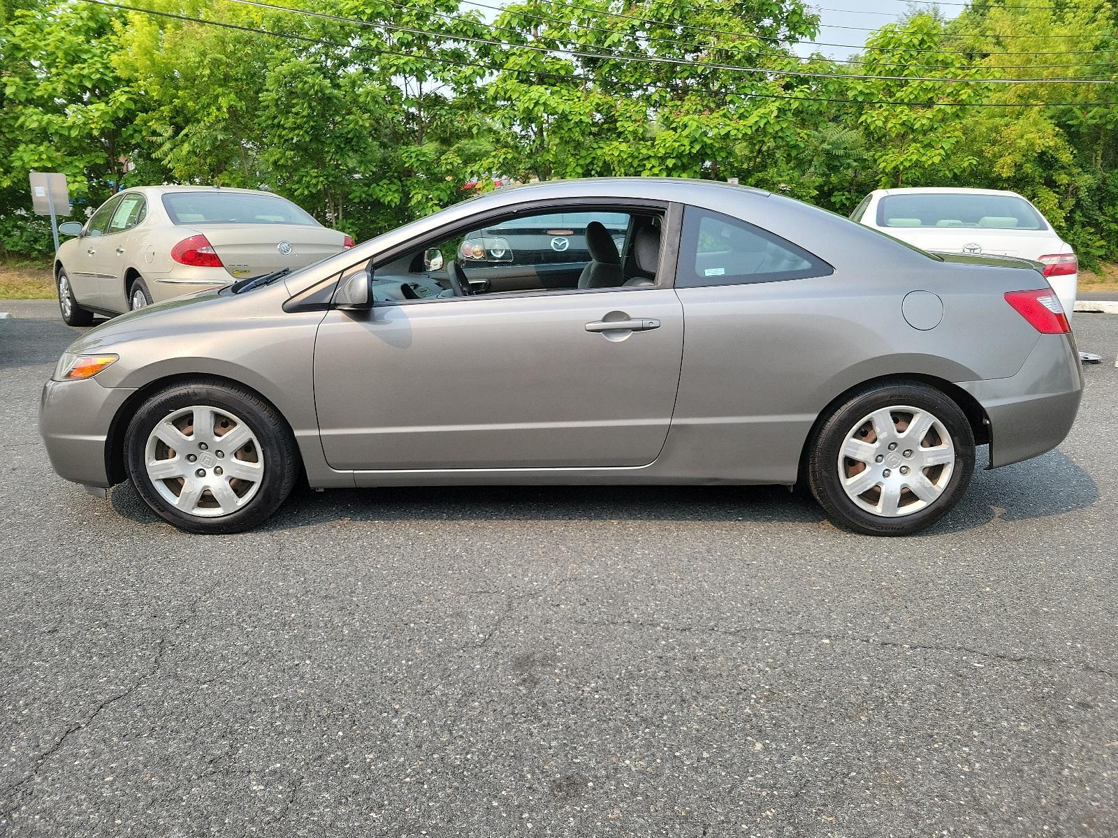 2007 Galaxy Gray Metallic - GY /Gray - GR Honda Civic Cpe LX (2HGFG11657H) with an 1.8L SOHC MPFI 16-valve i-VTEC I4 engine engine, located at 50 Eastern Blvd., Essex, MD, 21221, (410) 686-3444, 39.304367, -76.484947 - <p>Our 2007 Honda Civic LX Sedan in Alabaster Silver Metallic retains the efficient, economic design and quality components that have made it one of the world's most popular and successful compact cars! Power comes from a 1.8 Liter 4 Cylinder generating 140hp while paired to a smooth-shifting 5 Spee - Photo #6