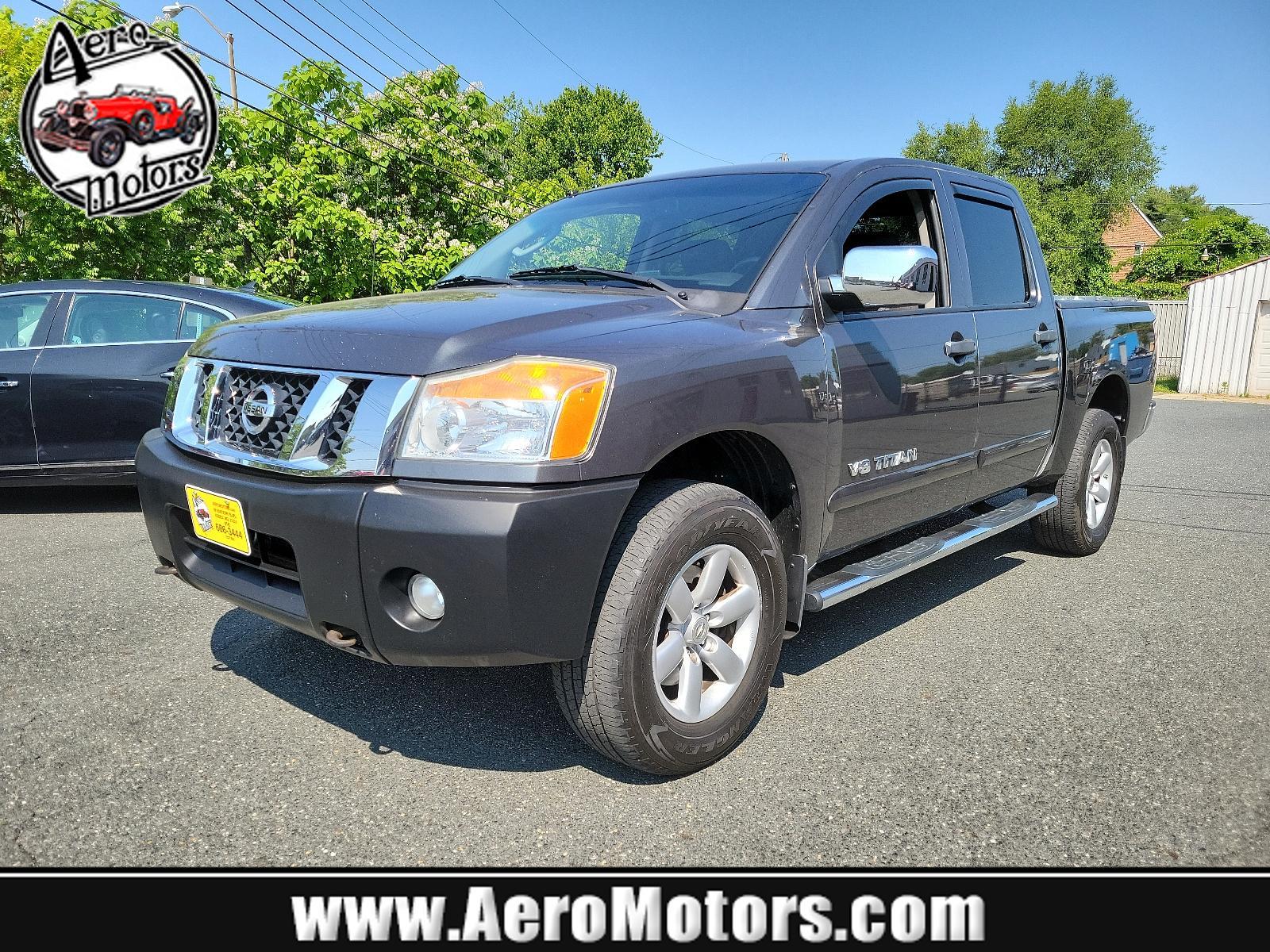 2011 Smoke - K11 /Charcoal - G Nissan Titan SV (1N6BA0EC3BN) , located at 50 Eastern Blvd., Essex, MD, 21221, (410) 686-3444, 39.304367, -76.484947 - <p>Our 2011 Nissan Titan SV Crew Cab 4X4 in Smoke Metallic is stylish, smart, and adventurous! Powered by a 5.6 Liter V8 that delivers 317hp paired with a durable 5 Speed Automatic transmission for passing authority. This Four Wheel Drive offers up to 17mpg along with impressive acceleration and a s - Photo #0