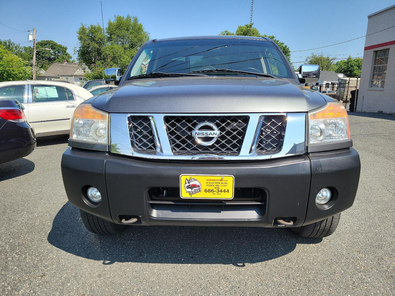 2011 Smoke - K11 /Charcoal - G Nissan Titan SV (1N6BA0EC3BN) , located at 50 Eastern Blvd., Essex, MD, 21221, (410) 686-3444, 39.304367, -76.484947 - <p>Our 2011 Nissan Titan SV Crew Cab 4X4 in Smoke Metallic is stylish, smart, and adventurous! Powered by a 5.6 Liter V8 that delivers 317hp paired with a durable 5 Speed Automatic transmission for passing authority. This Four Wheel Drive offers up to 17mpg along with impressive acceleration and a s - Photo #1
