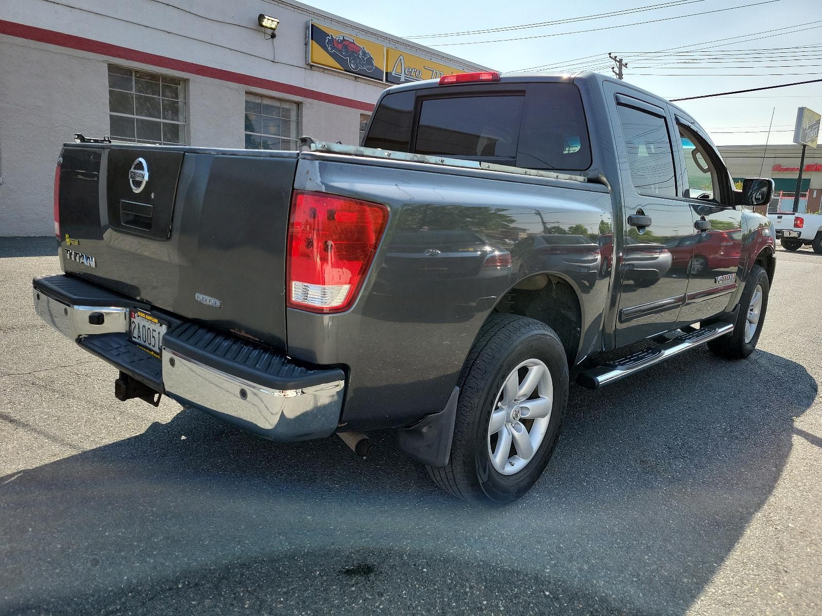 2011 Smoke - K11 /Charcoal - G Nissan Titan SV (1N6BA0EC3BN) , located at 50 Eastern Blvd., Essex, MD, 21221, (410) 686-3444, 39.304367, -76.484947 - <p>Our 2011 Nissan Titan SV Crew Cab 4X4 in Smoke Metallic is stylish, smart, and adventurous! Powered by a 5.6 Liter V8 that delivers 317hp paired with a durable 5 Speed Automatic transmission for passing authority. This Four Wheel Drive offers up to 17mpg along with impressive acceleration and a s - Photo #3