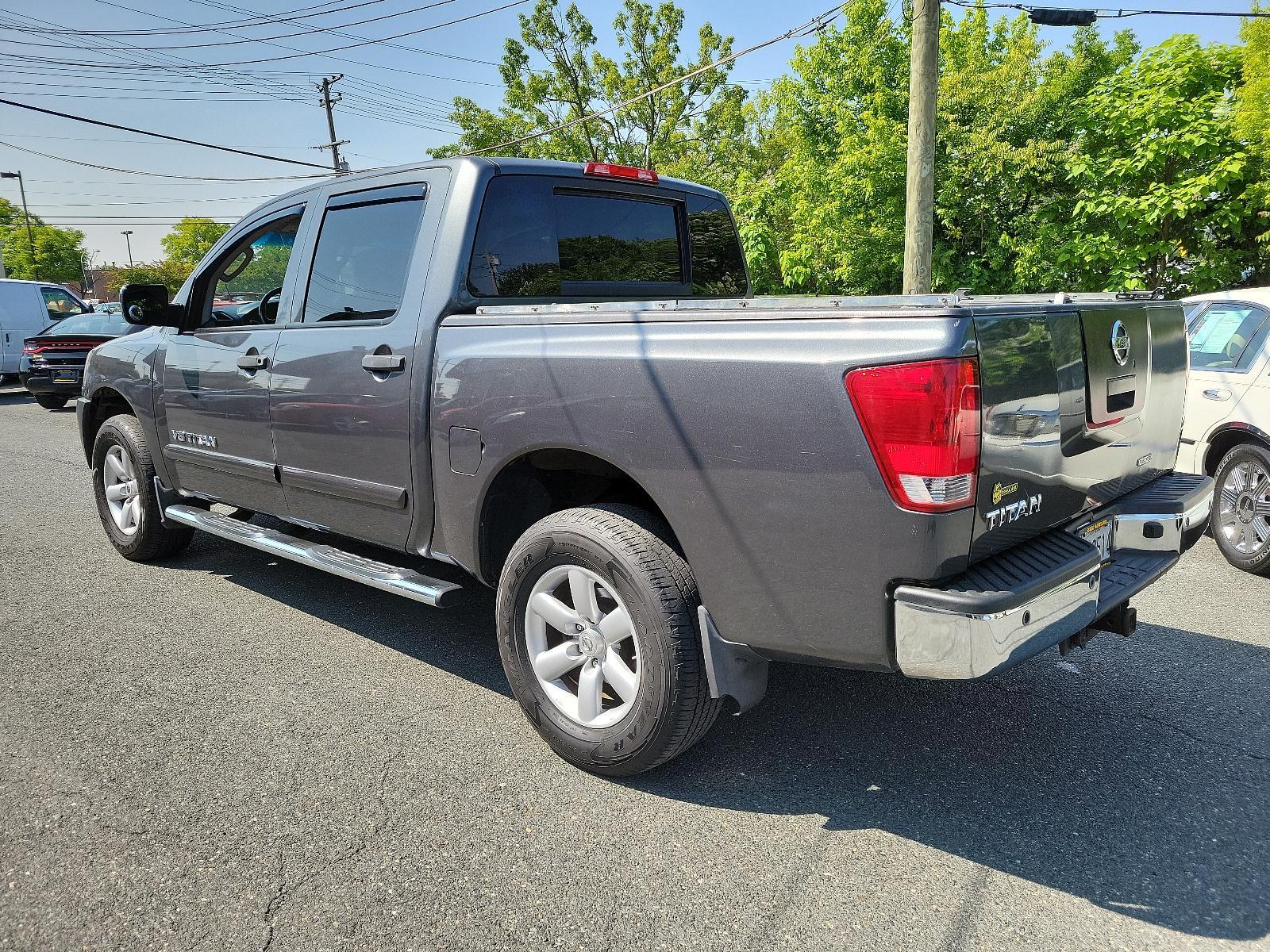 2011 Smoke - K11 /Charcoal - G Nissan Titan SV (1N6BA0EC3BN) , located at 50 Eastern Blvd., Essex, MD, 21221, (410) 686-3444, 39.304367, -76.484947 - <p>Our 2011 Nissan Titan SV Crew Cab 4X4 in Smoke Metallic is stylish, smart, and adventurous! Powered by a 5.6 Liter V8 that delivers 317hp paired with a durable 5 Speed Automatic transmission for passing authority. This Four Wheel Drive offers up to 17mpg along with impressive acceleration and a s - Photo #4