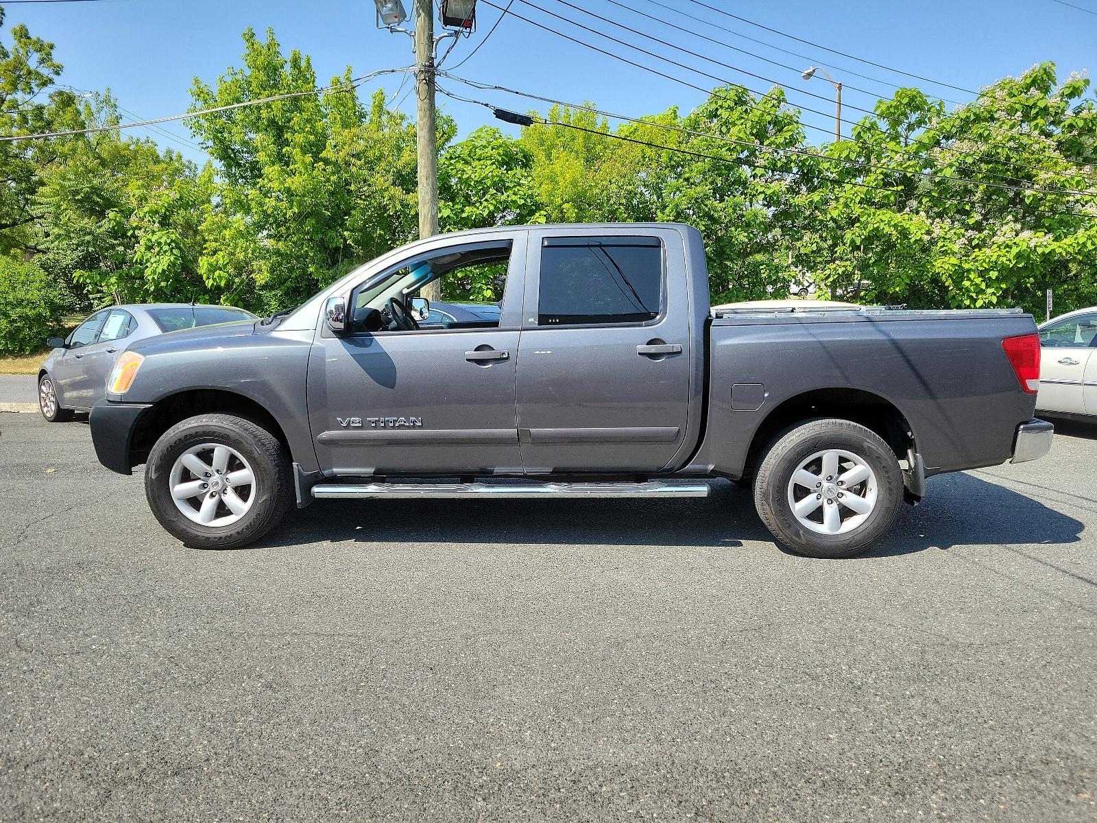 2011 Smoke - K11 /Charcoal - G Nissan Titan SV (1N6BA0EC3BN) , located at 50 Eastern Blvd., Essex, MD, 21221, (410) 686-3444, 39.304367, -76.484947 - <p>Our 2011 Nissan Titan SV Crew Cab 4X4 in Smoke Metallic is stylish, smart, and adventurous! Powered by a 5.6 Liter V8 that delivers 317hp paired with a durable 5 Speed Automatic transmission for passing authority. This Four Wheel Drive offers up to 17mpg along with impressive acceleration and a s - Photo #5