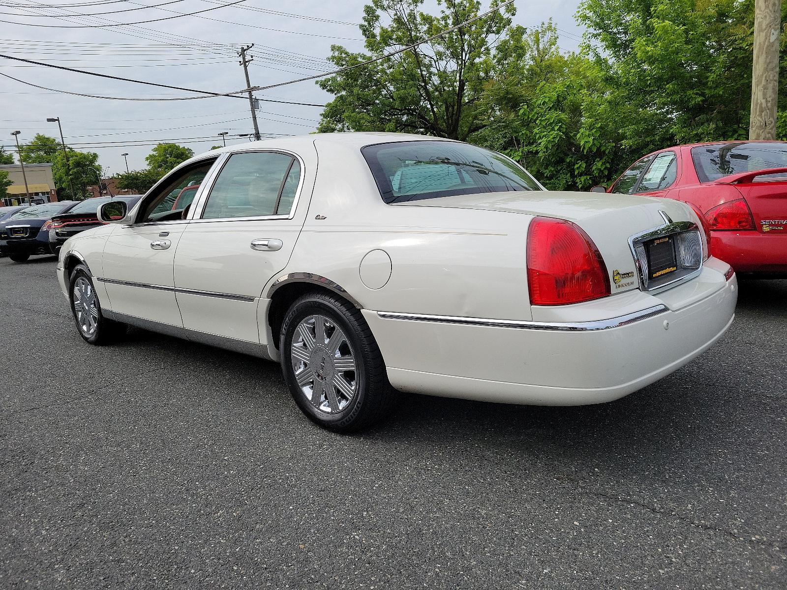 2003 Ceramic White - F6 /Light Parchment - F Lincoln Town Car Cartier Premium (1LNHM83W03Y) with an 4.6L SOHC SMPI V8 ENGINE engine, located at 50 Eastern Blvd., Essex, MD, 21221, (410) 686-3444, 39.304367, -76.484947 - <p>Full-size luxury at its finest, introducing our 2003 Lincoln Town Car Cartier Premium Sedan showcased in Ceramic White. Powered by a 4.6 Liter V8 generating 239hp paired with a 4 Speed Automatic transmission. This Rear Wheel Drive sedan's smooth lines and chrome wheels help it earn up to 25mpg on - Photo #5