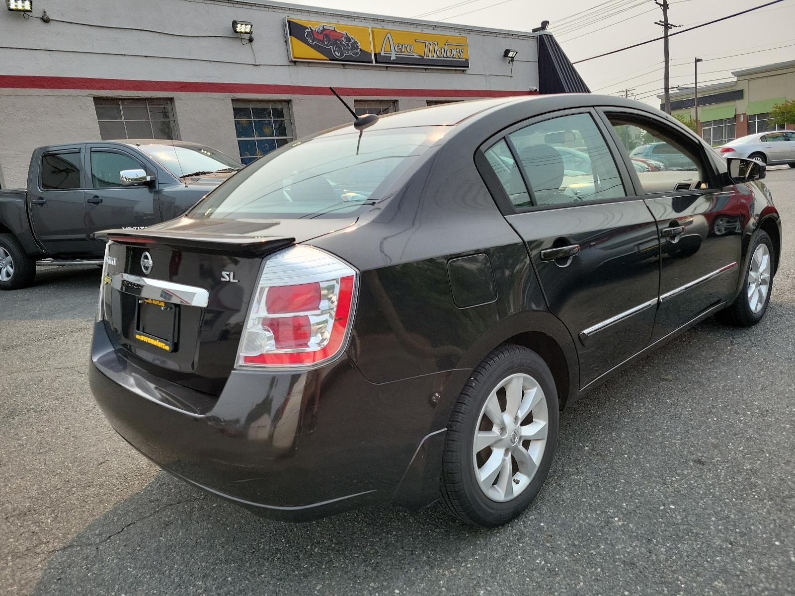 2011 Espresso Black - CAE /Charcoal - X Nissan Sentra 2.0 SL (3N1AB6AP2BL) with an 2.0L DOHC 16-valve SMPI I4 engine engine, located at 50 Eastern Blvd., Essex, MD, 21221, (410) 686-3444, 39.304367, -76.484947 - <p>Meet our 2011 Nissan Sentra 2.0 SL Sedan in Super Black, and you will know you have made the right choice! Powered by a 2.0 Liter 4 Cylinder generating 140hp connected to an innovative CVT. Our Front Wheel Drive sedan offers nearly 34mpg on the highway and boasts a driving experience you will lov - Photo #3