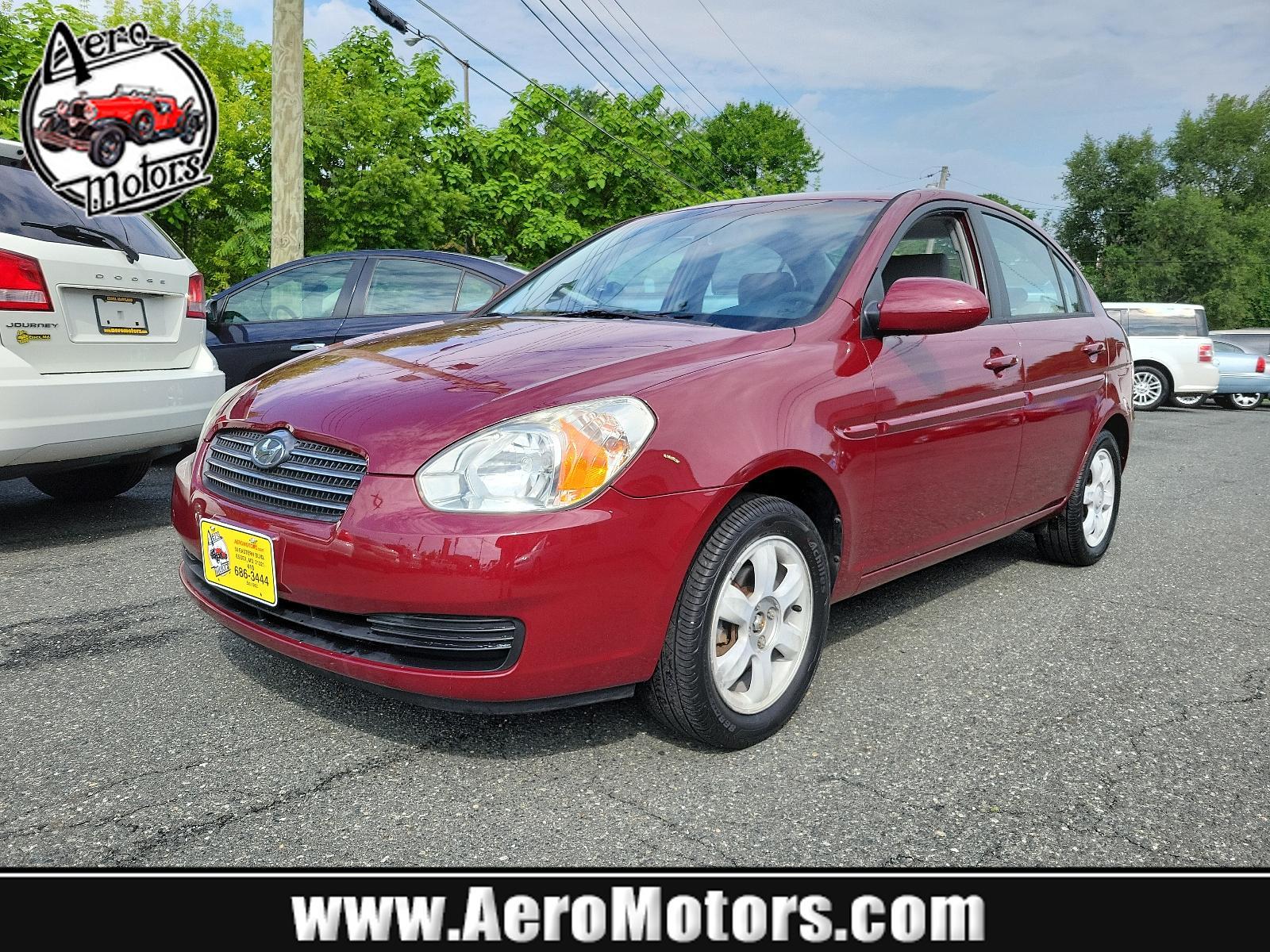 2006 Wine Red Pearl - 5R /Gray - FZ Hyundai Accent GLS (KMHCN46C26U) with an 1.6L DOHC MPI 16-valve I4 engine w/continuously variable valve timing (CVVT) engine, located at 50 Eastern Blvd., Essex, MD, 21221, (410) 686-3444, 39.304367, -76.484947 - <p>Our 2006 Hyundai Elantra GLS Sedan presented in Wine Red Pearl boasts comfort and style. Powered by an efficient 1.6 Liter 4 Cylinder connected to a 5 Speed Automatic transmission. Our Front Wheel Drive Sedan boasts nearly 36mpg on the open road and turns heads with its timeless styling. </p><p>< - Photo #0