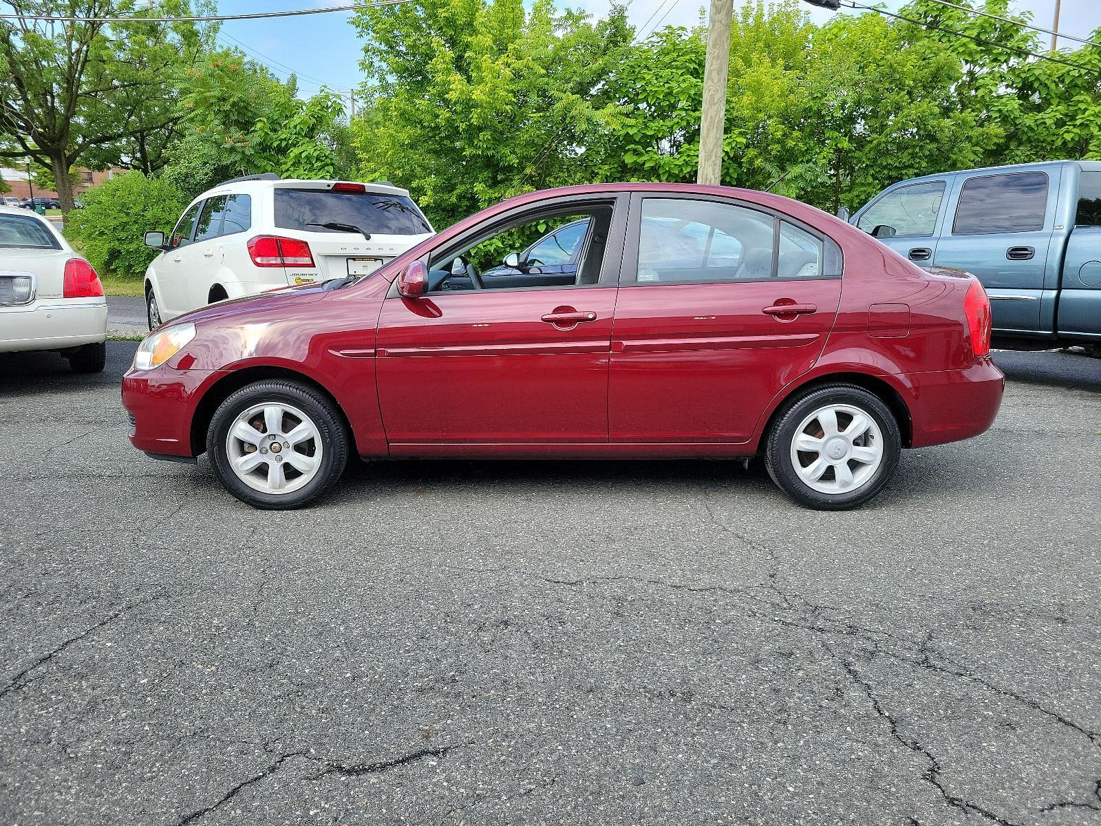 2006 Wine Red Pearl - 5R /Gray - FZ Hyundai Accent GLS (KMHCN46C26U) with an 1.6L DOHC MPI 16-valve I4 engine w/continuously variable valve timing (CVVT) engine, located at 50 Eastern Blvd., Essex, MD, 21221, (410) 686-3444, 39.304367, -76.484947 - <p>Our 2006 Hyundai Elantra GLS Sedan presented in Wine Red Pearl boasts comfort and style. Powered by an efficient 1.6 Liter 4 Cylinder connected to a 5 Speed Automatic transmission. Our Front Wheel Drive Sedan boasts nearly 36mpg on the open road and turns heads with its timeless styling. </p><p>< - Photo #6