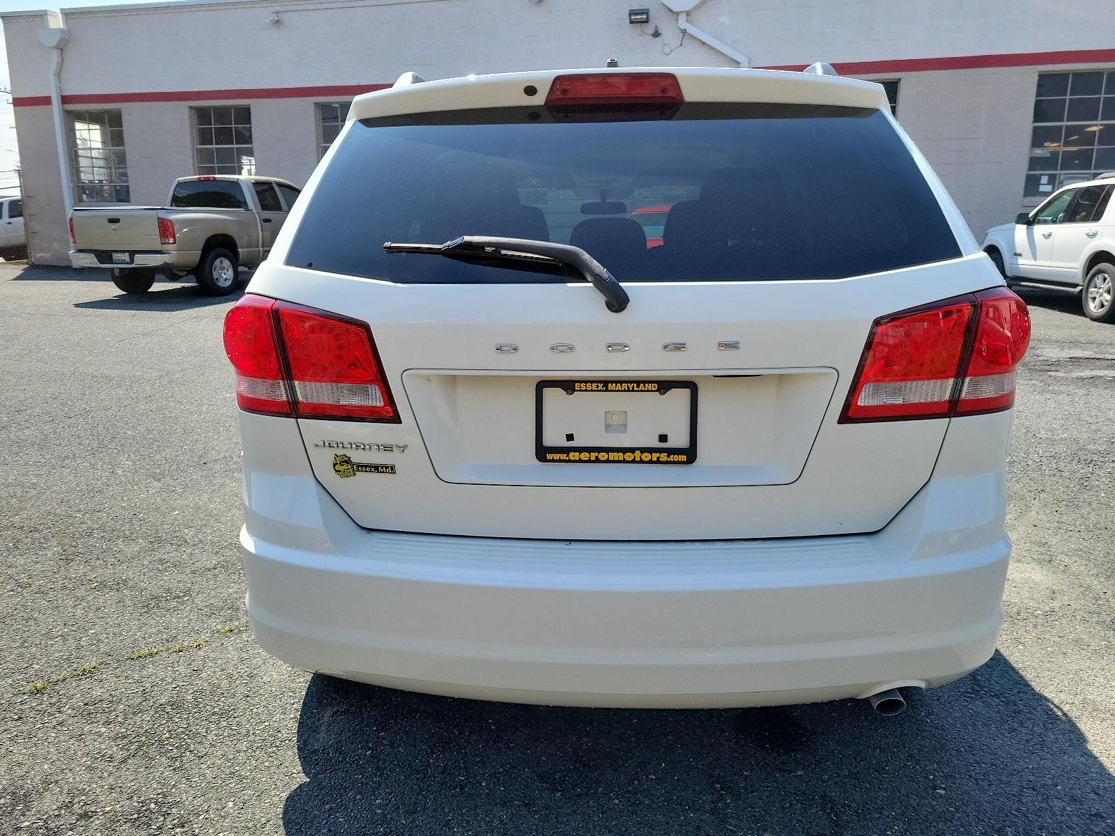 2011 White - PW3 /Black Interior - E5X9 Dodge Journey Express (3D4PG4FB3BT) with an 2.4L DOHC DUAL VVT 16-VALVE I4 ENGINE engine, located at 50 Eastern Blvd., Essex, MD, 21221, (410) 686-3444, 39.304367, -76.484947 - <p>Our attractive 2011 Dodge Journey Express Crossover is shown in White. Motived by our 2.4 Liter 4 Cylinder that offers 173hp connected to a 4 Speed AutoStick transmission for the ability to put it in Drive and forget or run through the gears with the flip of your wrist for that sports car feel. T - Photo #4