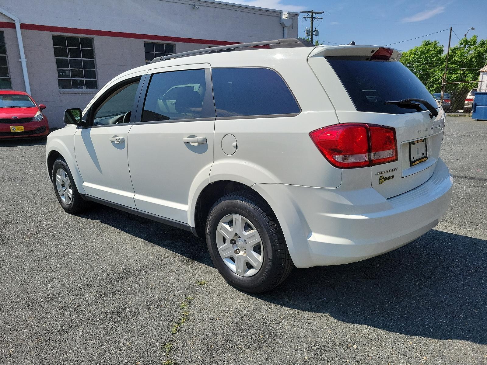 2011 White - PW3 /Black Interior - E5X9 Dodge Journey Express (3D4PG4FB3BT) with an 2.4L DOHC DUAL VVT 16-VALVE I4 ENGINE engine, located at 50 Eastern Blvd., Essex, MD, 21221, (410) 686-3444, 39.304367, -76.484947 - <p>Our attractive 2011 Dodge Journey Express Crossover is shown in White. Motived by our 2.4 Liter 4 Cylinder that offers 173hp connected to a 4 Speed AutoStick transmission for the ability to put it in Drive and forget or run through the gears with the flip of your wrist for that sports car feel. T - Photo #5