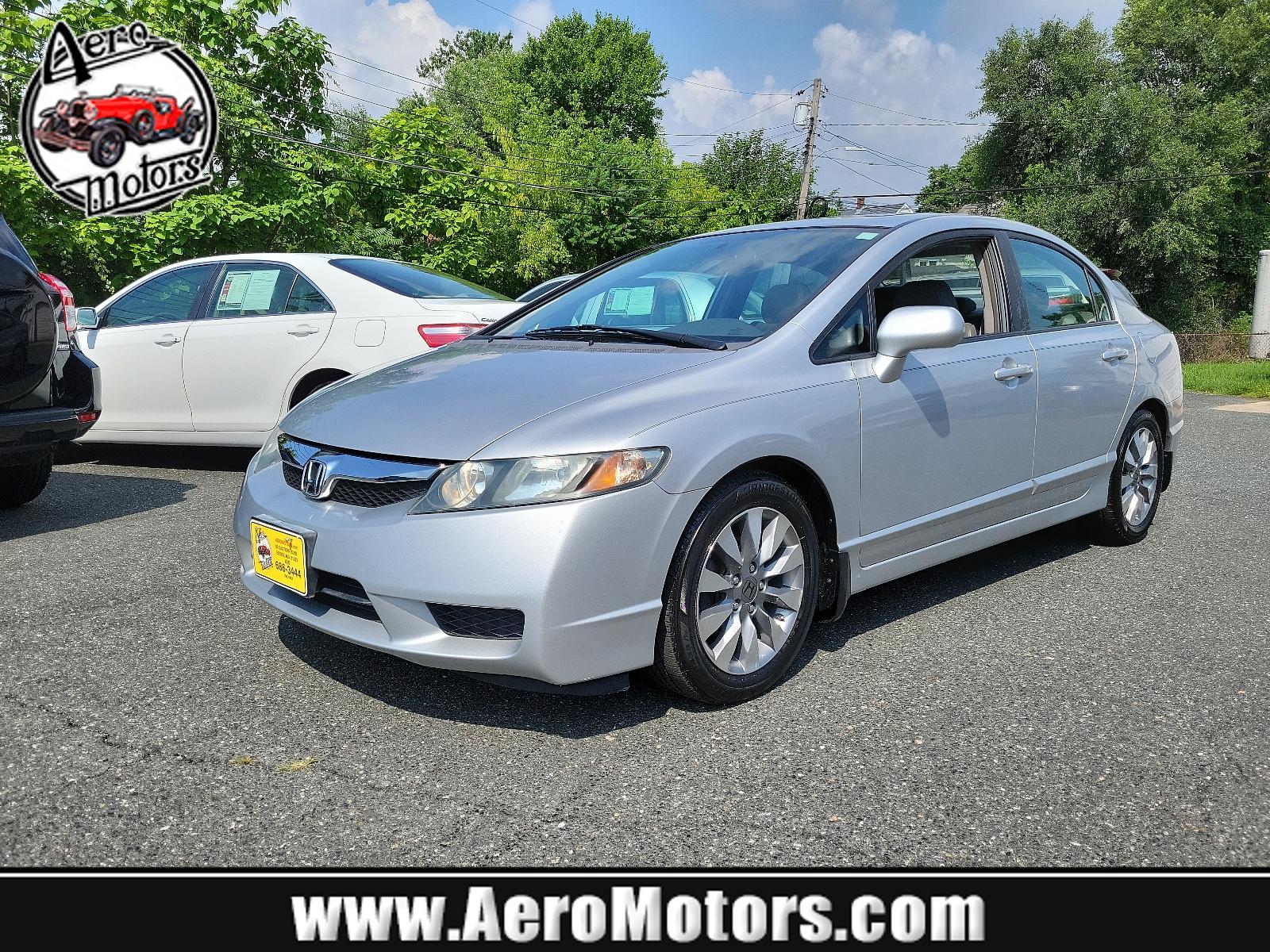 2009 Alabaster Silver Metallic - SI /Gray - GR Honda Civic Sdn EX-L (1HGFA16949L) with an 1.8L SOHC MPFI 16-valve i-VTEC I4 engine engine, located at 50 Eastern Blvd., Essex, MD, 21221, (410) 686-3444, 39.304367, -76.484947 - <p>You'll be impressed with our 2009 Honda Civic EX-L Sedan that stands out in Alabaster Silver Metallic. Powered by a 1.8 Liter 4 Cylinder that offers 140hp paired to a 5 Speed Automatic transmission for zippy acceleration. You will have more than enough power for both around-town and highway drivi - Photo #0