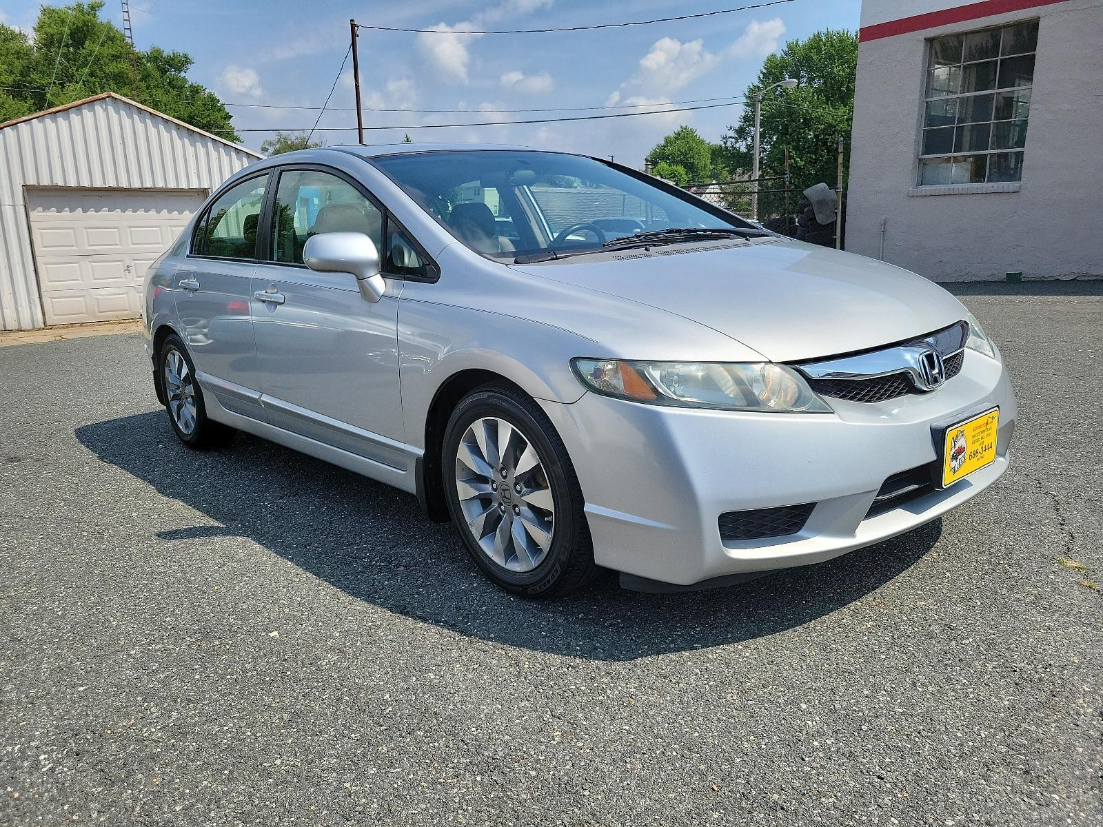 2009 Alabaster Silver Metallic - SI /Gray - GR Honda Civic Sdn EX-L (1HGFA16949L) with an 1.8L SOHC MPFI 16-valve i-VTEC I4 engine engine, located at 50 Eastern Blvd., Essex, MD, 21221, (410) 686-3444, 39.304367, -76.484947 - <p>You'll be impressed with our 2009 Honda Civic EX-L Sedan that stands out in Alabaster Silver Metallic. Powered by a 1.8 Liter 4 Cylinder that offers 140hp paired to a 5 Speed Automatic transmission for zippy acceleration. You will have more than enough power for both around-town and highway drivi - Photo #2