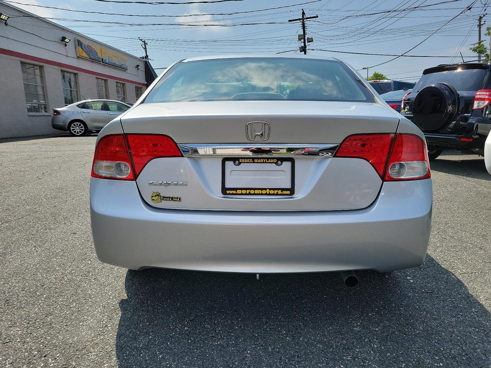 2009 Alabaster Silver Metallic - SI /Gray - GR Honda Civic Sdn EX-L (1HGFA16949L) with an 1.8L SOHC MPFI 16-valve i-VTEC I4 engine engine, located at 50 Eastern Blvd., Essex, MD, 21221, (410) 686-3444, 39.304367, -76.484947 - <p>You'll be impressed with our 2009 Honda Civic EX-L Sedan that stands out in Alabaster Silver Metallic. Powered by a 1.8 Liter 4 Cylinder that offers 140hp paired to a 5 Speed Automatic transmission for zippy acceleration. You will have more than enough power for both around-town and highway drivi - Photo #4