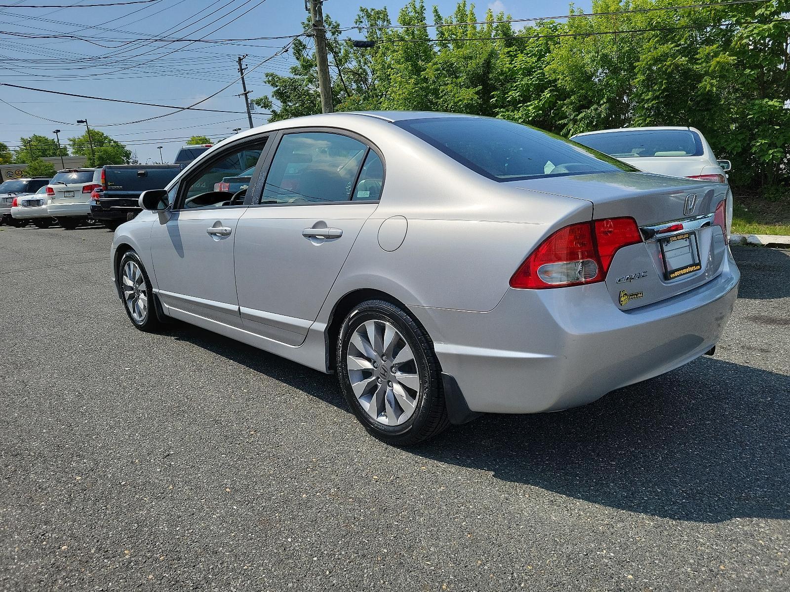 2009 Alabaster Silver Metallic - SI /Gray - GR Honda Civic Sdn EX-L (1HGFA16949L) with an 1.8L SOHC MPFI 16-valve i-VTEC I4 engine engine, located at 50 Eastern Blvd., Essex, MD, 21221, (410) 686-3444, 39.304367, -76.484947 - <p>You'll be impressed with our 2009 Honda Civic EX-L Sedan that stands out in Alabaster Silver Metallic. Powered by a 1.8 Liter 4 Cylinder that offers 140hp paired to a 5 Speed Automatic transmission for zippy acceleration. You will have more than enough power for both around-town and highway drivi - Photo #5