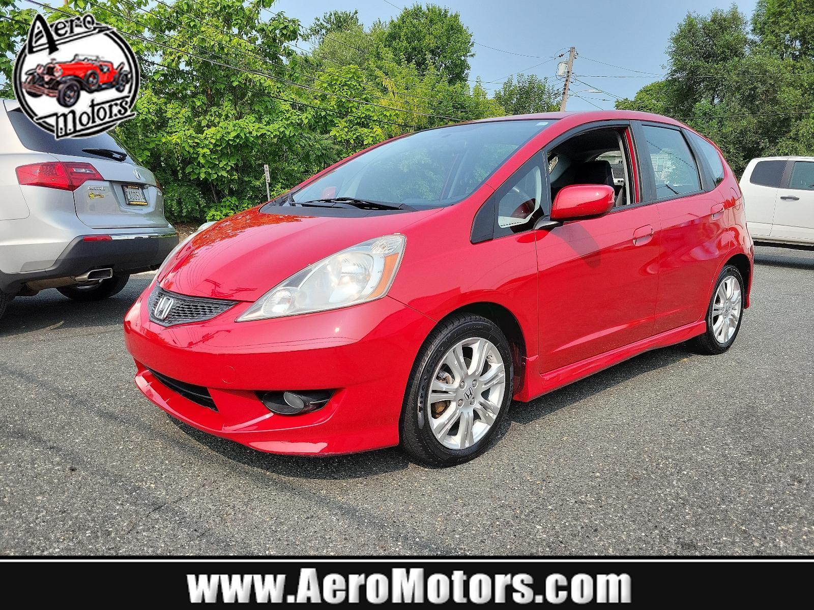2009 Milano Red - RE /Black - BK Honda Fit Sport w/Navi (JHMGE88629S) with an 1.5L SOHC MPFI 16-valve i-VTEC I4 engine engine, located at 50 Eastern Blvd., Essex, MD, 21221, (410) 686-3444, 39.304367, -76.484947 - <p>Drive in style with our impressive 2009 Honda Fit Sport shown in Milano Red. Powered by an efficient 1.5 Liter 4 Cylinder that offers 117hp and is connected to a 5 Speed Automatic transmission. This Front Wheel Drive is sure to please any driver as it rewards you with nearly 33mpg on the highway. - Photo #0