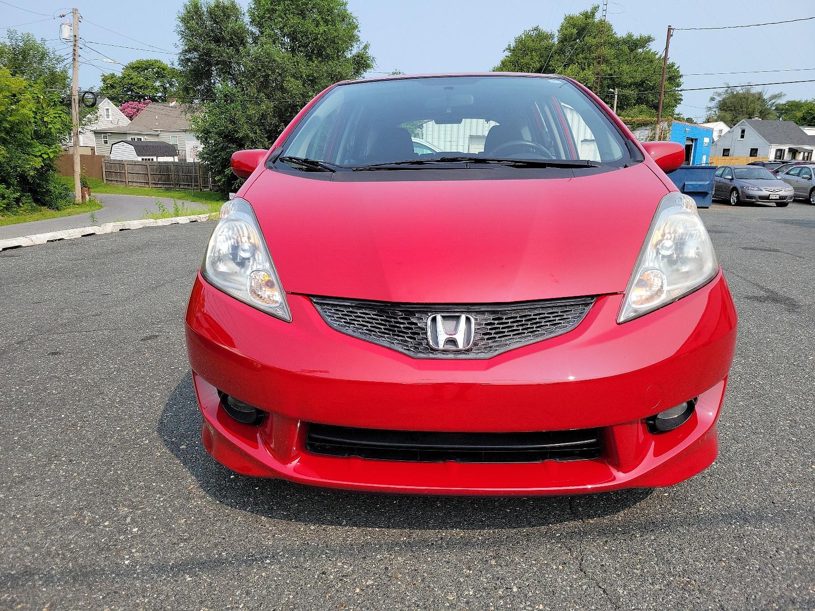 2009 Milano Red - RE /Black - BK Honda Fit Sport w/Navi (JHMGE88629S) with an 1.5L SOHC MPFI 16-valve i-VTEC I4 engine engine, located at 50 Eastern Blvd., Essex, MD, 21221, (410) 686-3444, 39.304367, -76.484947 - <p>Drive in style with our impressive 2009 Honda Fit Sport shown in Milano Red. Powered by an efficient 1.5 Liter 4 Cylinder that offers 117hp and is connected to a 5 Speed Automatic transmission. This Front Wheel Drive is sure to please any driver as it rewards you with nearly 33mpg on the highway. - Photo #1