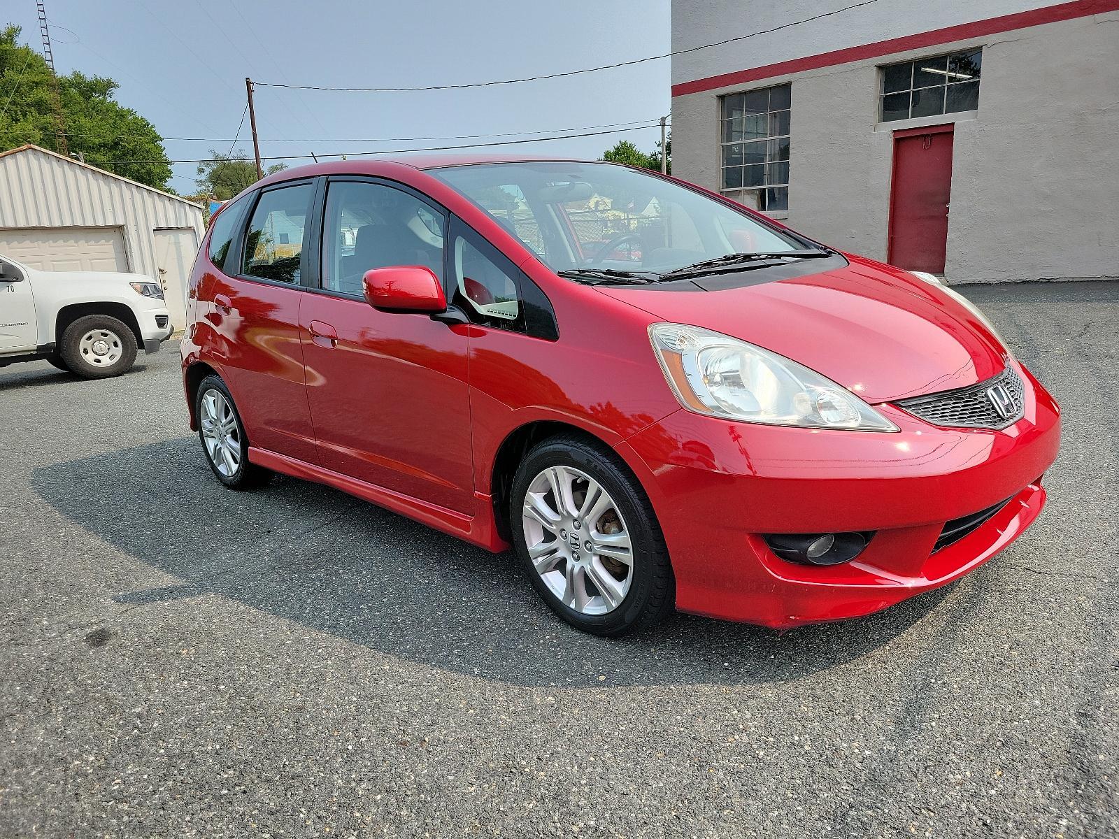 2009 Milano Red - RE /Black - BK Honda Fit Sport w/Navi (JHMGE88629S) with an 1.5L SOHC MPFI 16-valve i-VTEC I4 engine engine, located at 50 Eastern Blvd., Essex, MD, 21221, (410) 686-3444, 39.304367, -76.484947 - <p>Drive in style with our impressive 2009 Honda Fit Sport shown in Milano Red. Powered by an efficient 1.5 Liter 4 Cylinder that offers 117hp and is connected to a 5 Speed Automatic transmission. This Front Wheel Drive is sure to please any driver as it rewards you with nearly 33mpg on the highway. - Photo #2