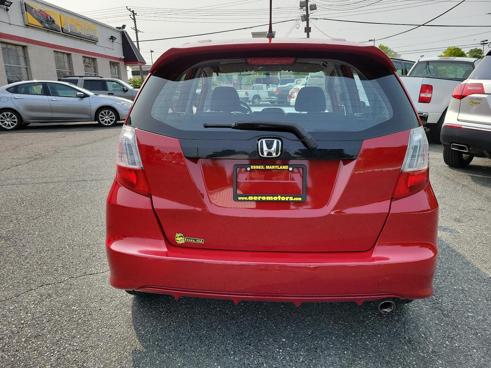 2009 Milano Red - RE /Black - BK Honda Fit Sport w/Navi (JHMGE88629S) with an 1.5L SOHC MPFI 16-valve i-VTEC I4 engine engine, located at 50 Eastern Blvd., Essex, MD, 21221, (410) 686-3444, 39.304367, -76.484947 - <p>Drive in style with our impressive 2009 Honda Fit Sport shown in Milano Red. Powered by an efficient 1.5 Liter 4 Cylinder that offers 117hp and is connected to a 5 Speed Automatic transmission. This Front Wheel Drive is sure to please any driver as it rewards you with nearly 33mpg on the highway. - Photo #4