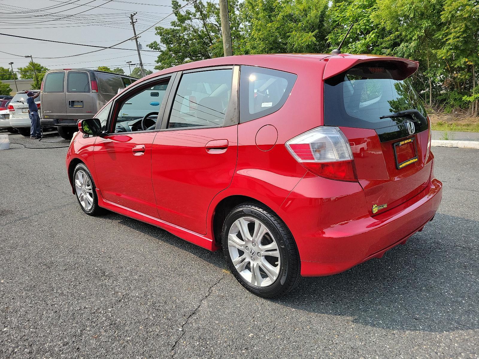 2009 Milano Red - RE /Black - BK Honda Fit Sport w/Navi (JHMGE88629S) with an 1.5L SOHC MPFI 16-valve i-VTEC I4 engine engine, located at 50 Eastern Blvd., Essex, MD, 21221, (410) 686-3444, 39.304367, -76.484947 - <p>Drive in style with our impressive 2009 Honda Fit Sport shown in Milano Red. Powered by an efficient 1.5 Liter 4 Cylinder that offers 117hp and is connected to a 5 Speed Automatic transmission. This Front Wheel Drive is sure to please any driver as it rewards you with nearly 33mpg on the highway. - Photo #5