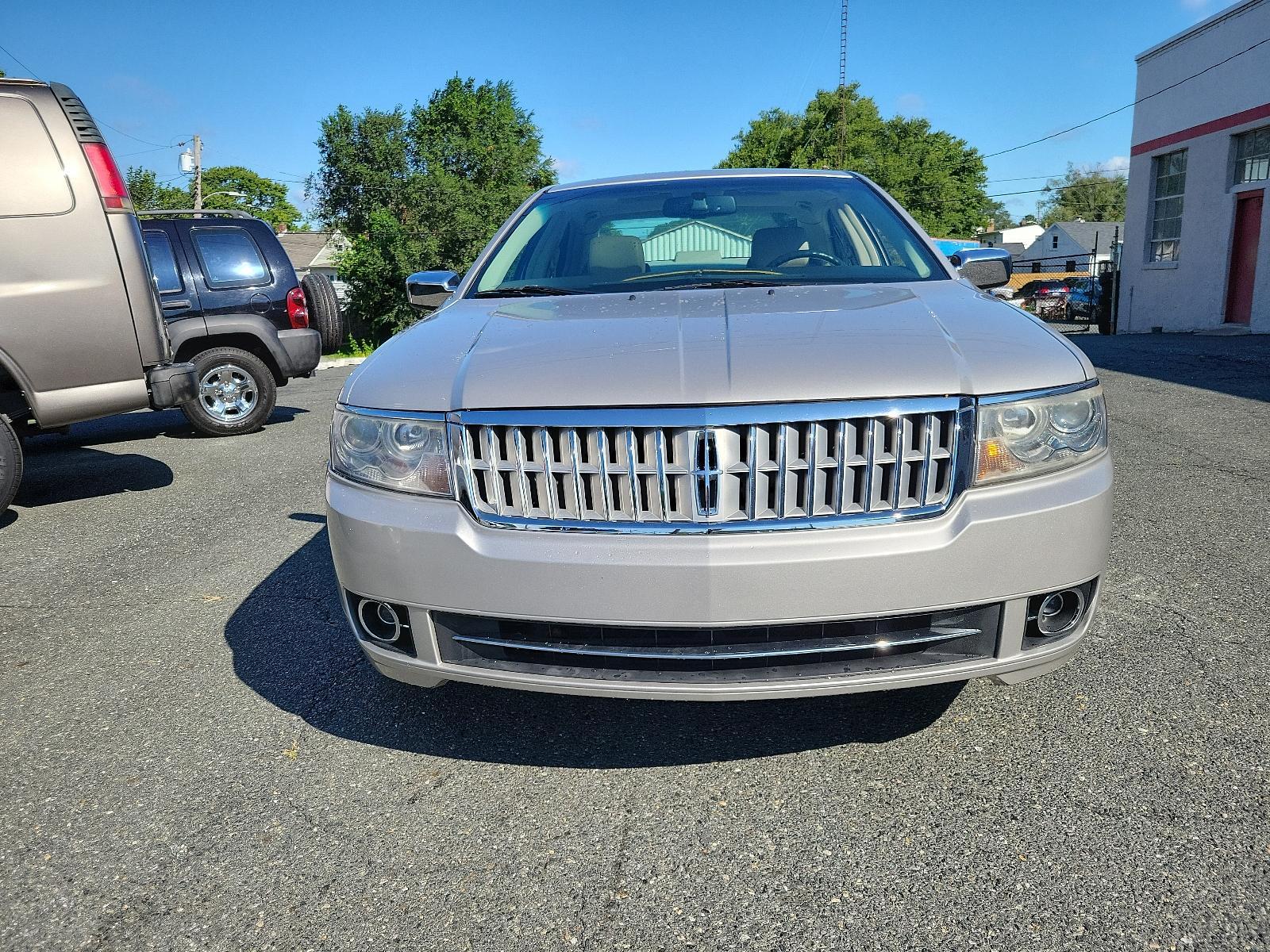 2007 Silver Birch Metallic - JP /Light Stone - T Lincoln MKZ (3LNHM26T77R) with an 3.5L DOHC 4V V6 DURATEC ENGINE engine, located at 50 Eastern Blvd., Essex, MD, 21221, (410) 686-3444, 39.304367, -76.484947 - Introducing the impressive 2007 Lincoln MKZ 4dr Sdn FWD. Finished in an elegant Silver Birch Metallic exterior and a sophisticated Light Stone - T interior, this ride delivers spectacular aesthetics. Under its hood revs a 3.5L DOHC 4V V6 Duratec engine, designed for seamless and efficient performanc - Photo #1