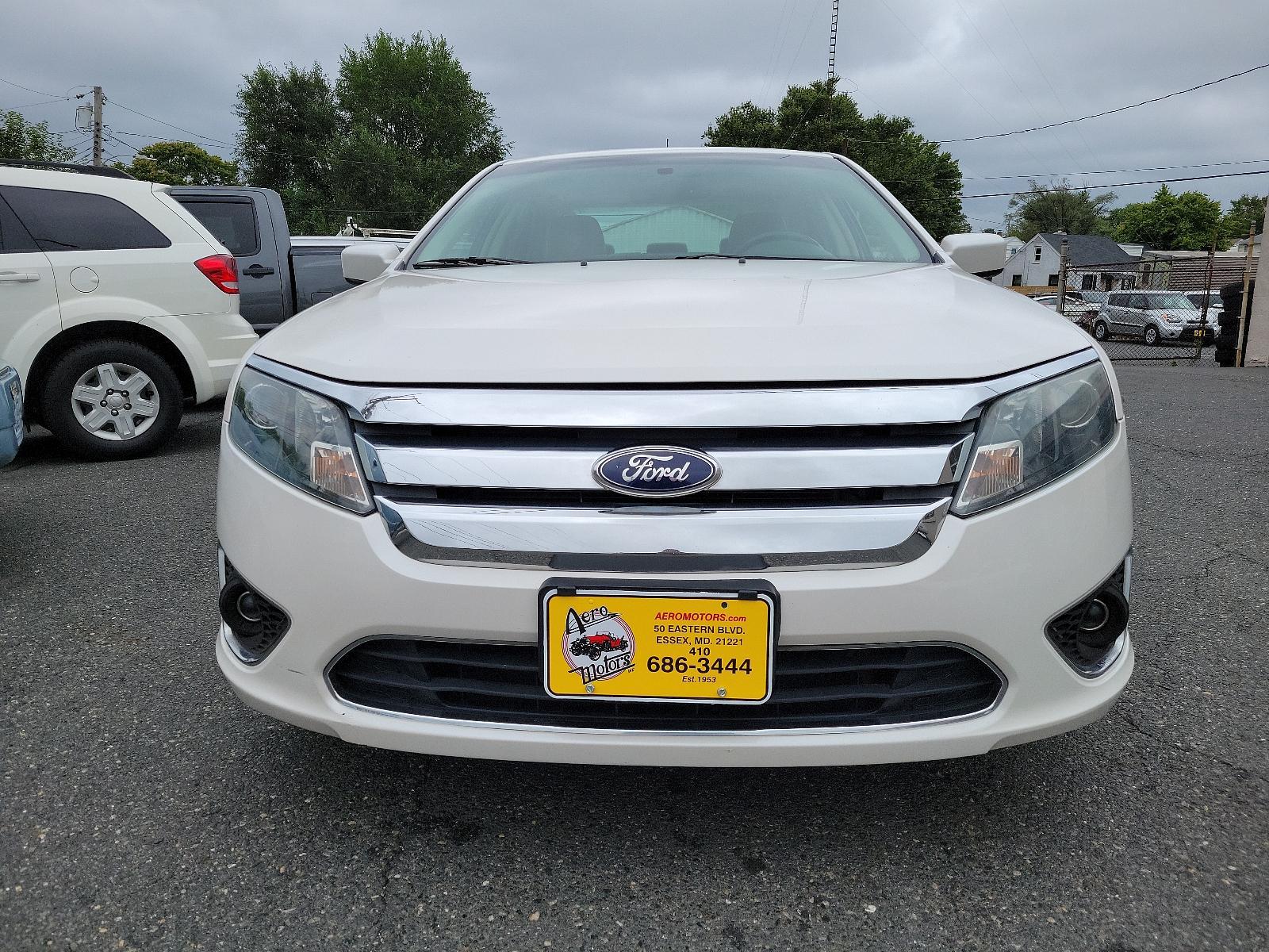 2010 White Platinum Metallic Tri-Coat - UG /Medium Light Stone - DL Ford Fusion SEL (3FAHP0JG8AR) with an 3.0L 24V V6 DURATEC FLEX FUEL ENGINE engine, located at 50 Eastern Blvd., Essex, MD, 21221, (410) 686-3444, 39.304367, -76.484947 - <p>Our great looking 2010 Ford Fusion SEL Sedan in White Platinum Metallic offers fuel efficiency, a spacious cabin, ride comfort, and great handling. Powered by a 3.0 Liter V6 that generates an impressive 240hp paired with a responsive 6 Speed Automatic transmission. This Front Wheel Drive is incre - Photo #1