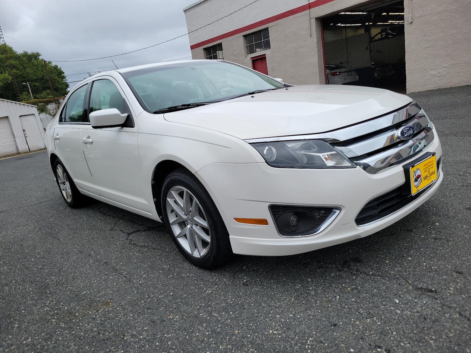 2010 White Platinum Metallic Tri-Coat - UG /Medium Light Stone - DL Ford Fusion SEL (3FAHP0JG8AR) with an 3.0L 24V V6 DURATEC FLEX FUEL ENGINE engine, located at 50 Eastern Blvd., Essex, MD, 21221, (410) 686-3444, 39.304367, -76.484947 - <p>Our great looking 2010 Ford Fusion SEL Sedan in White Platinum Metallic offers fuel efficiency, a spacious cabin, ride comfort, and great handling. Powered by a 3.0 Liter V6 that generates an impressive 240hp paired with a responsive 6 Speed Automatic transmission. This Front Wheel Drive is incre - Photo #2