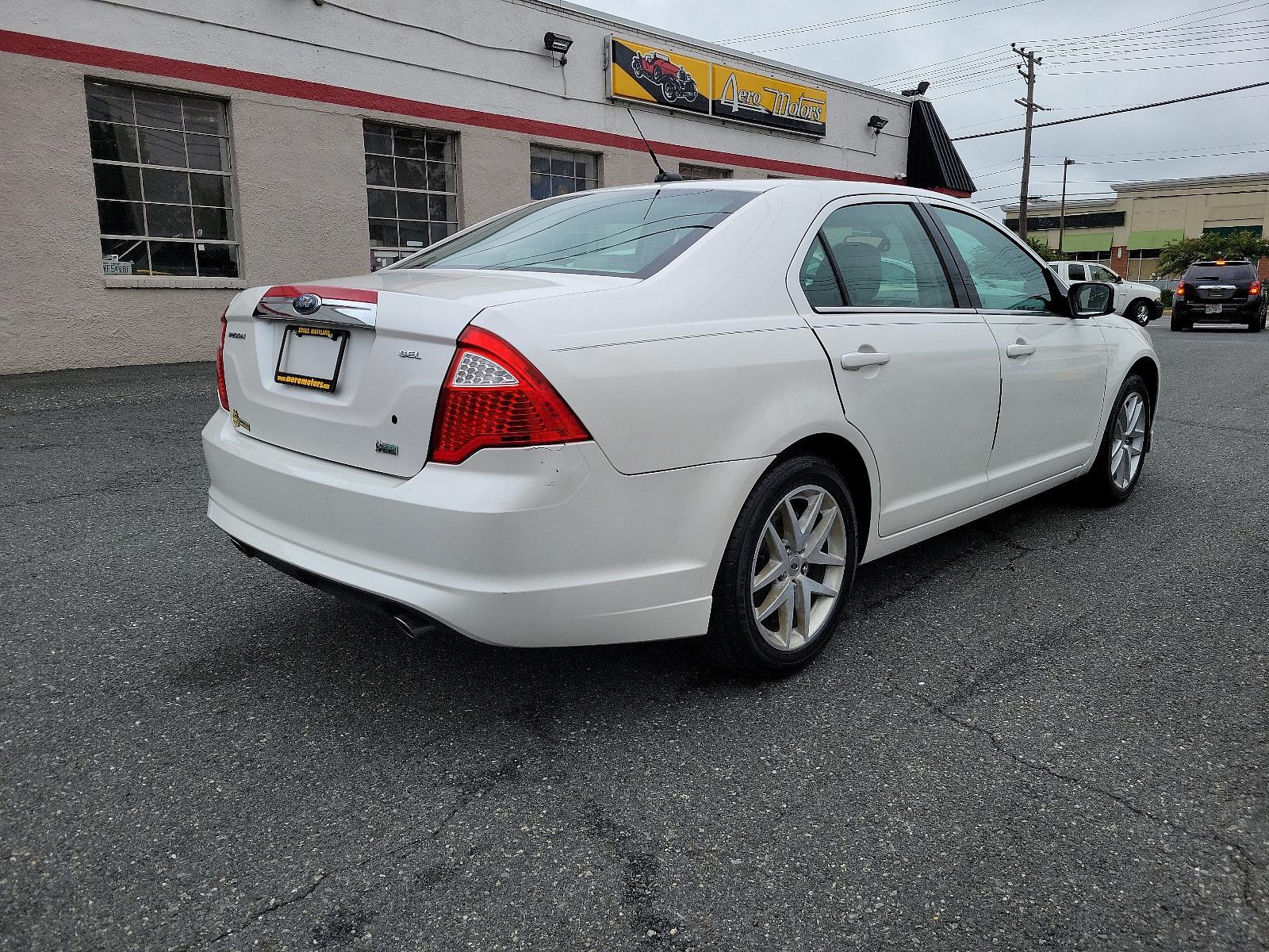 2010 White Platinum Metallic Tri-Coat - UG /Medium Light Stone - DL Ford Fusion SEL (3FAHP0JG8AR) with an 3.0L 24V V6 DURATEC FLEX FUEL ENGINE engine, located at 50 Eastern Blvd., Essex, MD, 21221, (410) 686-3444, 39.304367, -76.484947 - <p>Our great looking 2010 Ford Fusion SEL Sedan in White Platinum Metallic offers fuel efficiency, a spacious cabin, ride comfort, and great handling. Powered by a 3.0 Liter V6 that generates an impressive 240hp paired with a responsive 6 Speed Automatic transmission. This Front Wheel Drive is incre - Photo #3