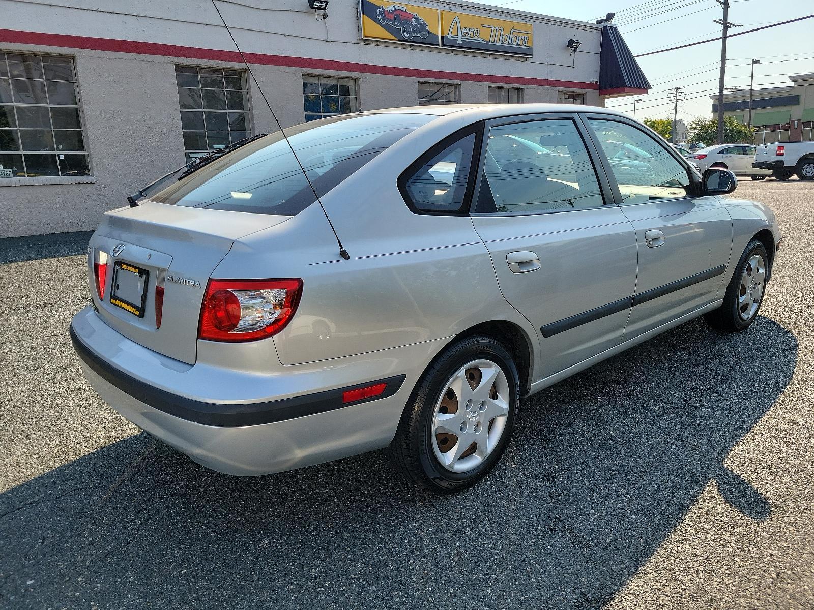 2006 Sterling Silver Metallic - TW /Gray - LT Hyundai Elantra GLS (KMHDN56D56U) with an 2.0L DOHC MPI 16-valve I4 engine w/continuously variable valve timing (CVVT) engine, located at 50 Eastern Blvd., Essex, MD, 21221, (410) 686-3444, 39.304367, -76.484947 - <p>Our 2006 Hyundai Elantra GLS Sedan presented in Sterling Silver Metallic boasts comfort and style. Powered by an efficient 2.0 Liter 4 Cylinder that offers plenty of power connected to a 5 Speed Automatic transmission. Our Front Wheel Drive sedan boasts nearly 36mpg on the open road and turns hea - Photo #3