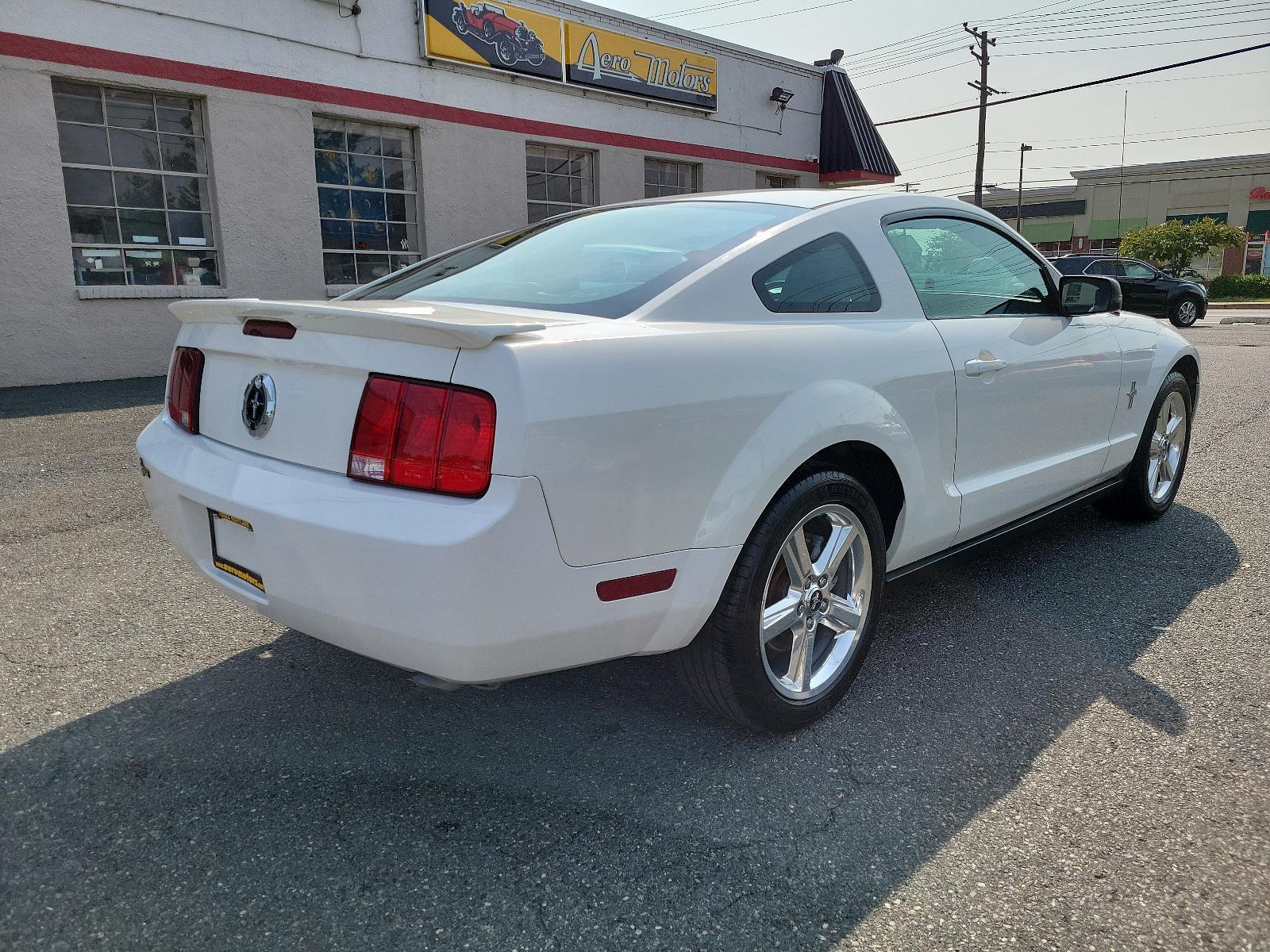 2008 Performance White - HP /Black/Chamois - 4 Ford Mustang Premium (1ZVHT80N785) with an 4.0L SOHC V6 ENGINE engine, located at 50 Eastern Blvd., Essex, MD, 21221, (410) 686-3444, 39.304367, -76.484947 - <p>Nothing says modern American sports car better than our 2008 Ford Mustang Premium. Powered by a 4.0 Liter V6 generating 210hp connected to an Automatic transmission. You can expect this Rear Wheel Drive coupe to earn you nearly 24mpg on the highway while delivering a sporty ride. You will surely - Photo #3