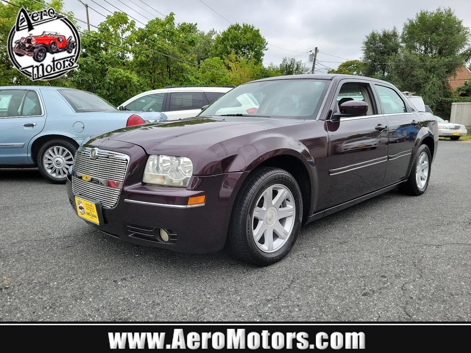 2005 Deep Lava Red Pearl - PMQ /Drk/M Slate Gray - DD Chrysler 300 300 Touring (2C3JA53G75H) with an 3.5L MPI 24-VALVE HO V6 ENGINE engine, located at 50 Eastern Blvd., Essex, MD, 21221, (410) 686-3444, 39.304367, -76.484947 - <p>Our 2005 Chrysler 300 Touring Sedan offers an incredible driving experience while shining bright in Deep Lava Red Pearl. Powered by a 3.5 Liter V6 that produces 250hp connected to a 4 Speed Automatic transmission. This Rear Wheel Drive drives well, earning nearly 25mpg on the highway.</p><p><br>< - Photo #0
