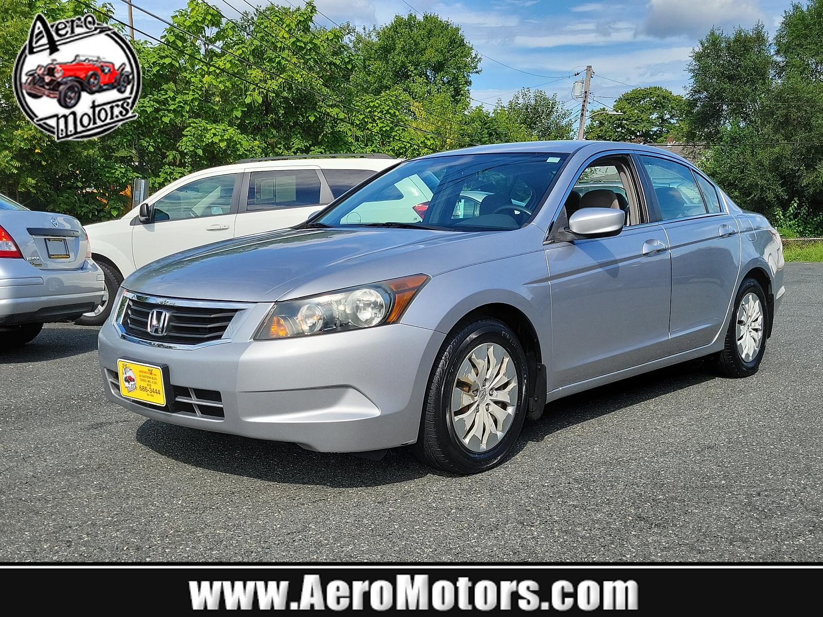 2009 Alabaster Silver Metallic - SI /Gray - GR Honda Accord Sdn LX (1HGCP26399A) with an 2.4L DOHC MPFI 16-valve i-VTEC I4 engine engine, located at 50 Eastern Blvd., Essex, MD, 21221, (410) 686-3444, 39.304367, -76.484947 - <p>Synonymous with value, efficiency, and reliability, our 2009 Honda Accord LX Sedan in Basque Red Pearl is a superb choice to take you from point A to point B in style! The 2.4 Liter 4 Cylinder offering 177hp while paired to a 5 Speed Automatic transmission provides a quiet, refined ride with exce - Photo #0