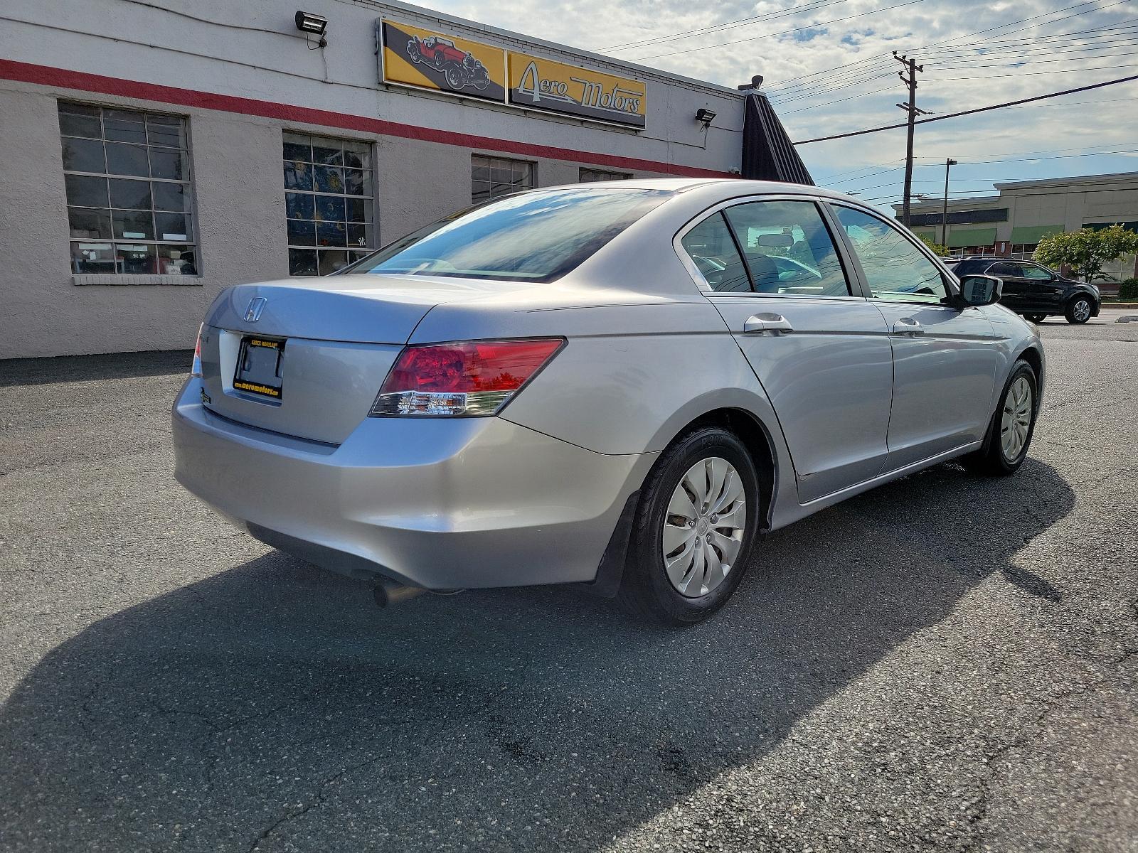 2009 Alabaster Silver Metallic - SI /Gray - GR Honda Accord Sdn LX (1HGCP26399A) with an 2.4L DOHC MPFI 16-valve i-VTEC I4 engine engine, located at 50 Eastern Blvd., Essex, MD, 21221, (410) 686-3444, 39.304367, -76.484947 - <p>Synonymous with value, efficiency, and reliability, our 2009 Honda Accord LX Sedan in Basque Red Pearl is a superb choice to take you from point A to point B in style! The 2.4 Liter 4 Cylinder offering 177hp while paired to a 5 Speed Automatic transmission provides a quiet, refined ride with exce - Photo #3