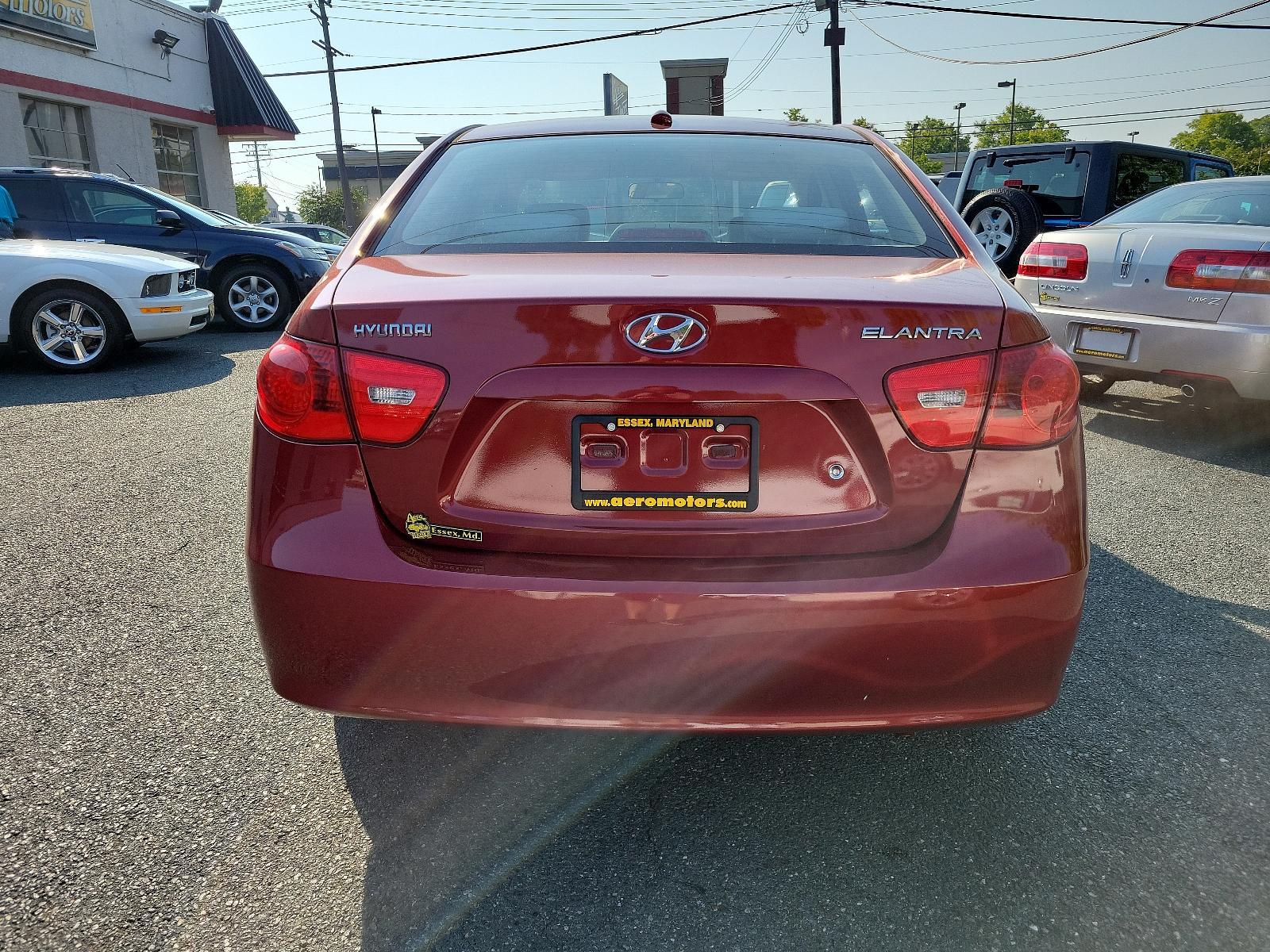 2008 Apple Red Pearl - ND /Beige - 9K Hyundai Elantra GLS (KMHDU46D48U) with an 2.0L DOHC CVVT 16-valve I4 engine engine, located at 50 Eastern Blvd., Essex, MD, 21221, (410) 686-3444, 39.304367, -76.484947 - <p>Attractive and purposeful, our 2008 Hyundai Elantra GLS Sedan is an excellent choice in Laguna Sand! Powered by a 2.0 Liter Inline 4 Cylinder producing 138hp while connected to a 4 Speed Automatic transmission. This Front Wheel Drive Sedan earns near 33mpg on the highway and delivers just what yo - Photo #4