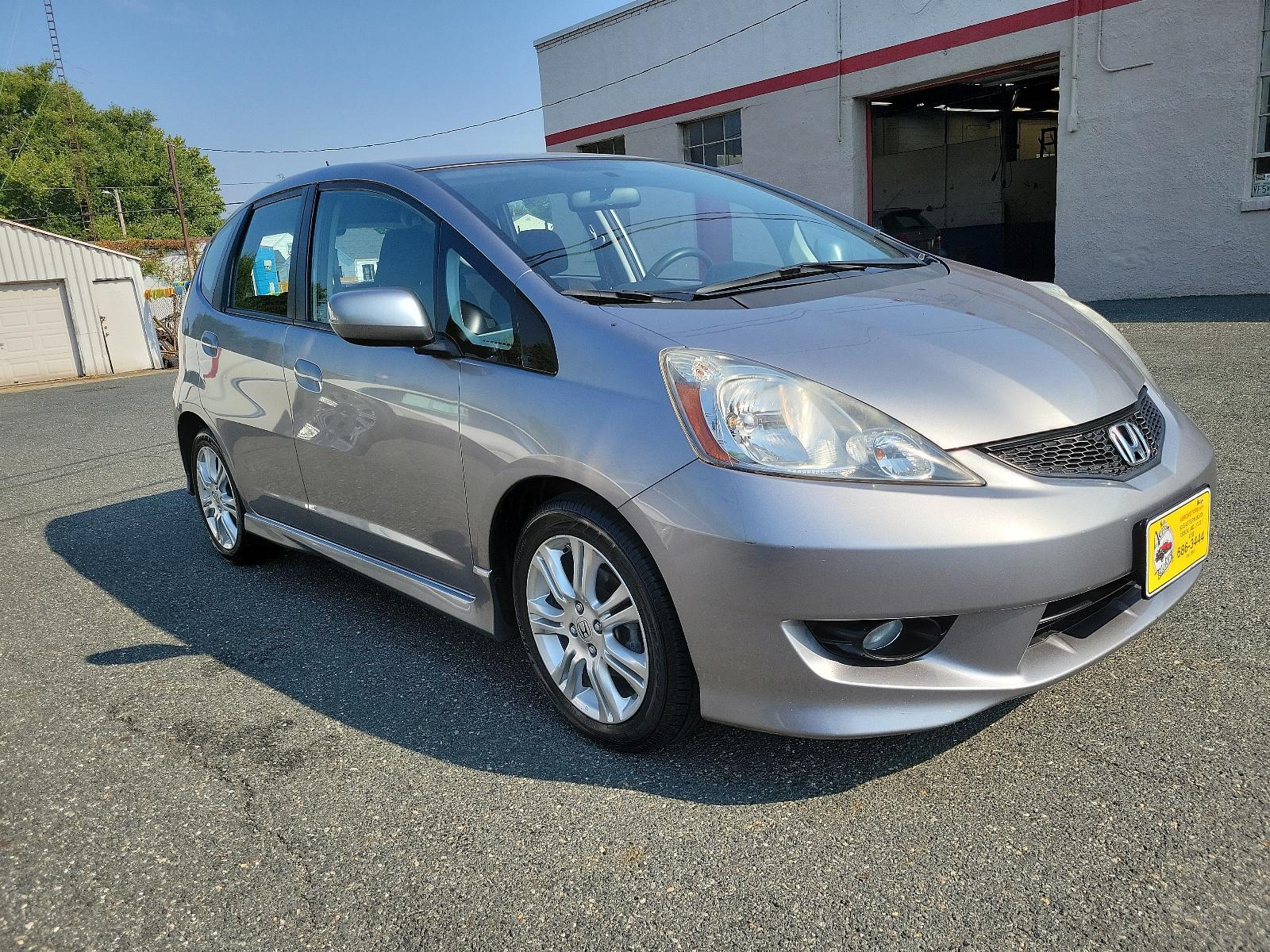 2009 Storm Silver Metallic - SI /Black - BK Honda Fit Sport w/Navi (JHMGE87689S) with an 1.5L SOHC MPFI 16-valve i-VTEC I4 engine engine, located at 50 Eastern Blvd., Essex, MD, 21221, (410) 686-3444, 39.304367, -76.484947 - <p>Check out this lively 2009 Honda Fit Sport on display in Storm Silve Metallic! Powered by an energetic 1.5 Liter 4 Cylinder offering 117hp while paired to a 5 Speed Manual transmission. This Front Wheel Drive combination will reward you with nearly 33mpg on the highway! It's not often you find a - Photo #2