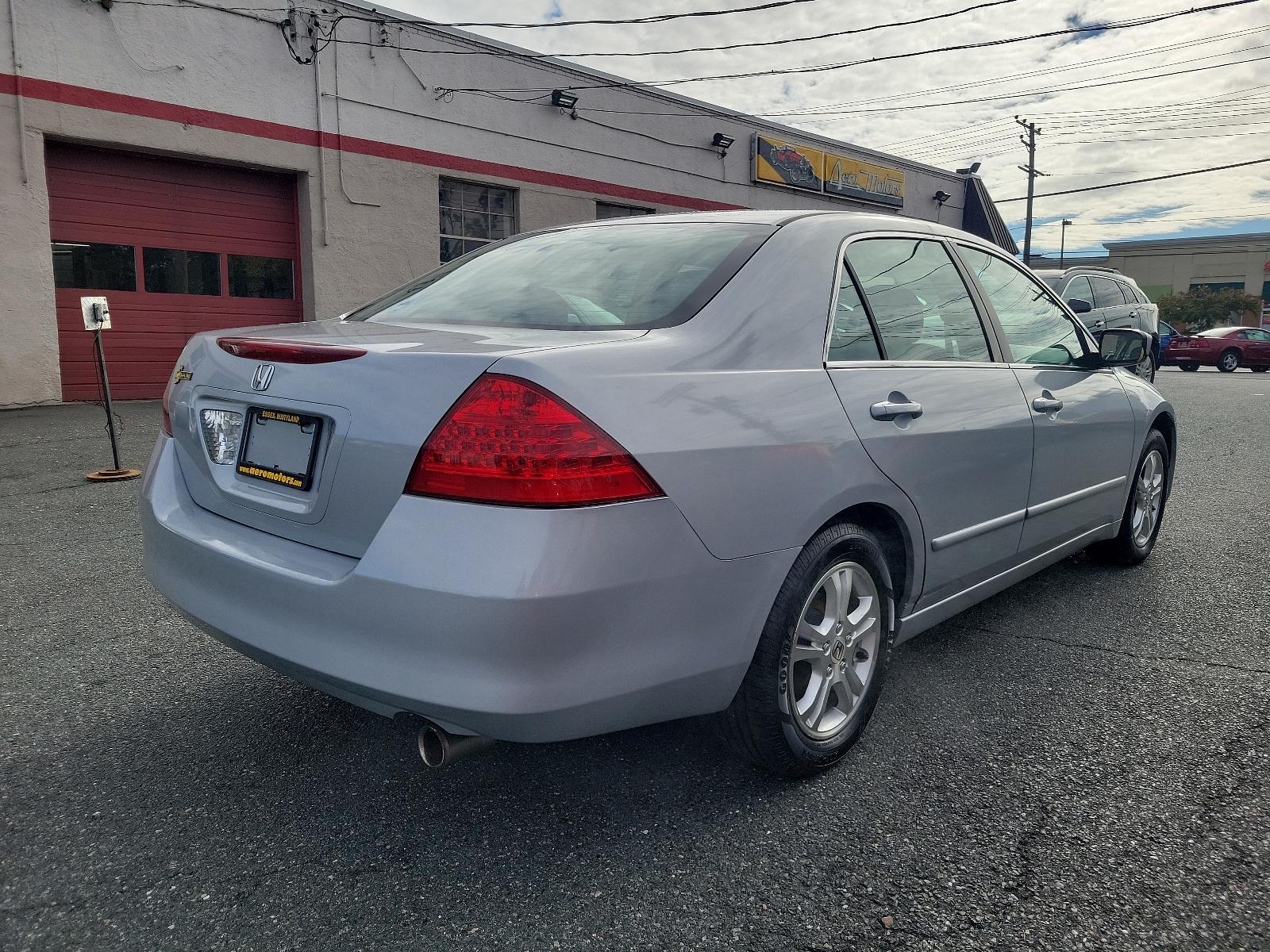 2006 Alabaster Silver Metallic - SI /Black - BK Honda Accord Sdn EX (1HGCM56766A) with an 2.4L DOHC MPFI 16-valve i-VTEC I4 engine engine, located at 50 Eastern Blvd., Essex, MD, 21221, (410) 686-3444, 39.304367, -76.484947 - Experience the synergy of comfort and reliability with this 2006 Honda Accord sedan. Dressed in a sleek silver exterior, this beauty exudes sophistication during every journey. While specific interior details are undefined, Honda is renowned for creating comfortable, highly-functional and user-frien - Photo #3