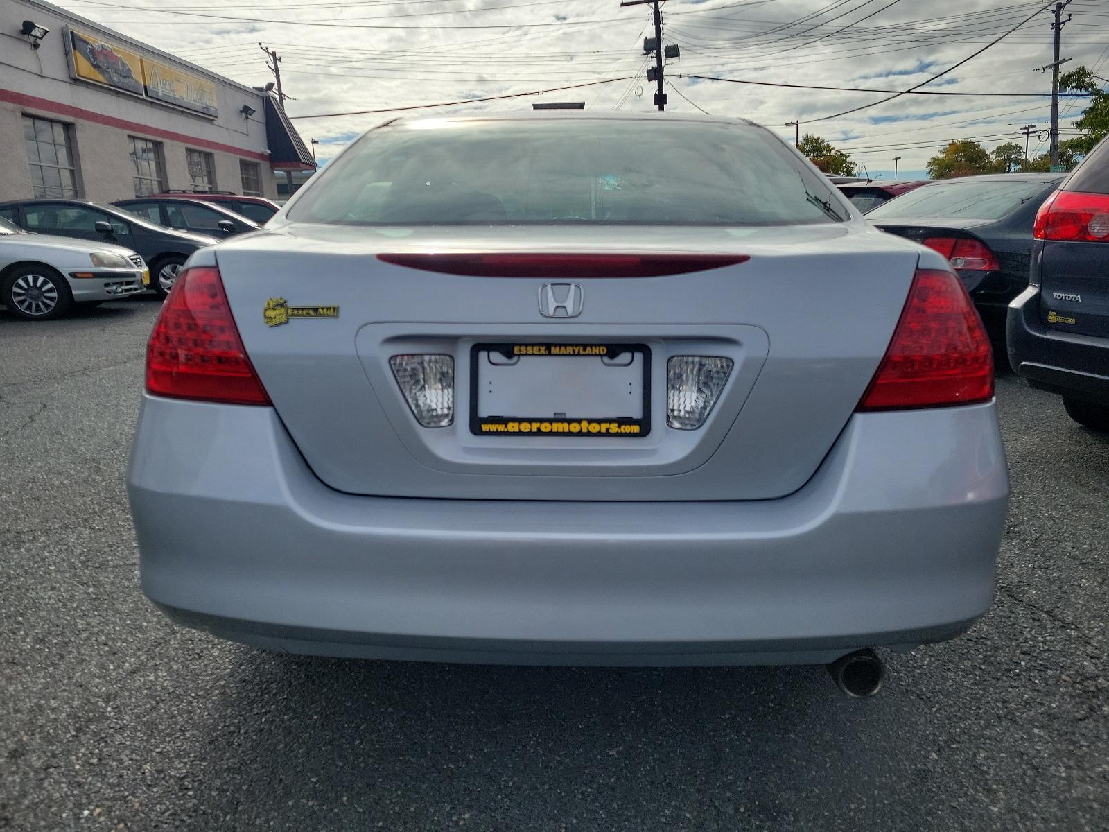 2006 Alabaster Silver Metallic - SI /Black - BK Honda Accord Sdn EX (1HGCM56766A) with an 2.4L DOHC MPFI 16-valve i-VTEC I4 engine engine, located at 50 Eastern Blvd., Essex, MD, 21221, (410) 686-3444, 39.304367, -76.484947 - Experience the synergy of comfort and reliability with this 2006 Honda Accord sedan. Dressed in a sleek silver exterior, this beauty exudes sophistication during every journey. While specific interior details are undefined, Honda is renowned for creating comfortable, highly-functional and user-frien - Photo #4