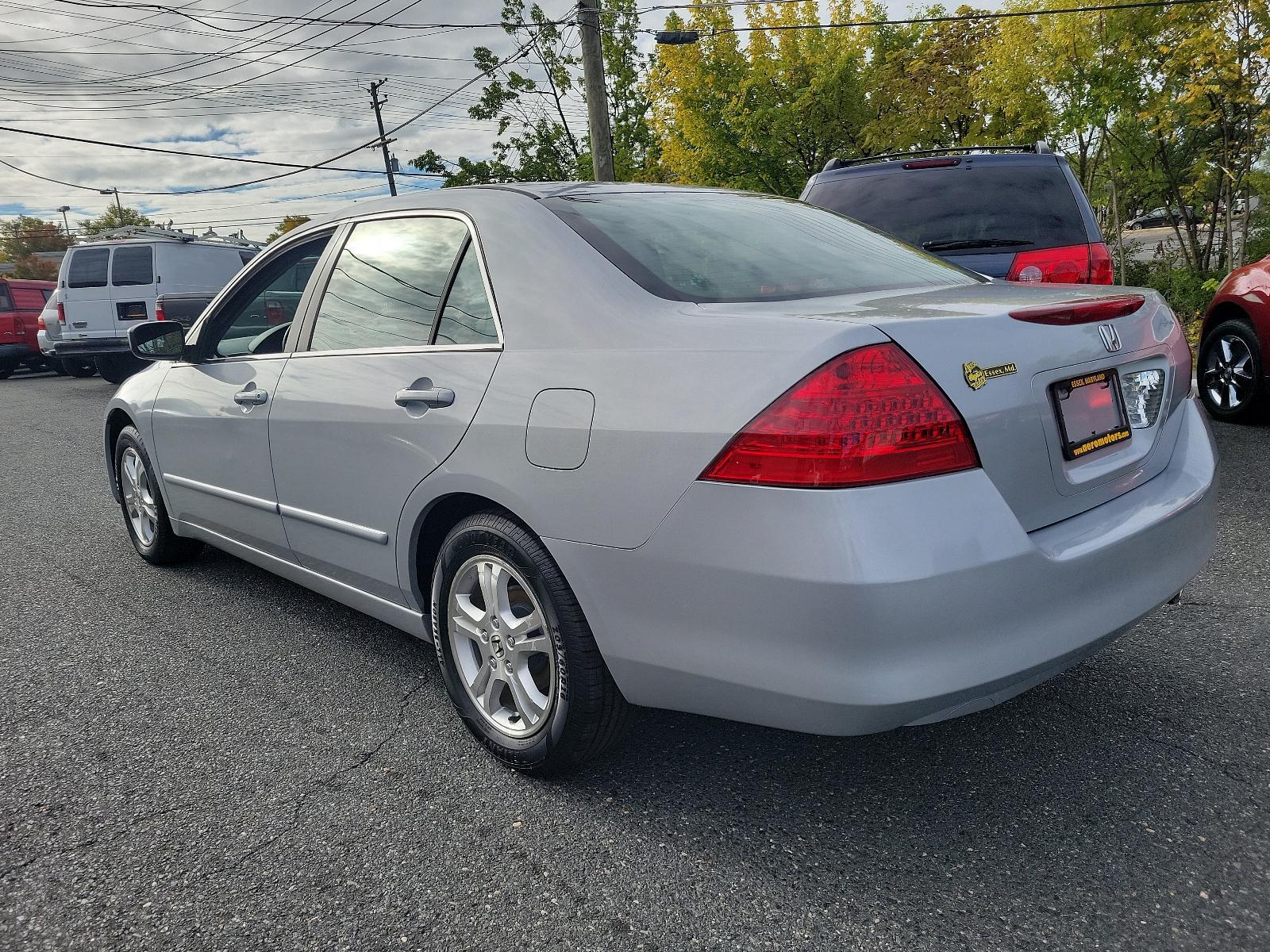 2006 Alabaster Silver Metallic - SI /Black - BK Honda Accord Sdn EX (1HGCM56766A) with an 2.4L DOHC MPFI 16-valve i-VTEC I4 engine engine, located at 50 Eastern Blvd., Essex, MD, 21221, (410) 686-3444, 39.304367, -76.484947 - Experience the synergy of comfort and reliability with this 2006 Honda Accord sedan. Dressed in a sleek silver exterior, this beauty exudes sophistication during every journey. While specific interior details are undefined, Honda is renowned for creating comfortable, highly-functional and user-frien - Photo #5