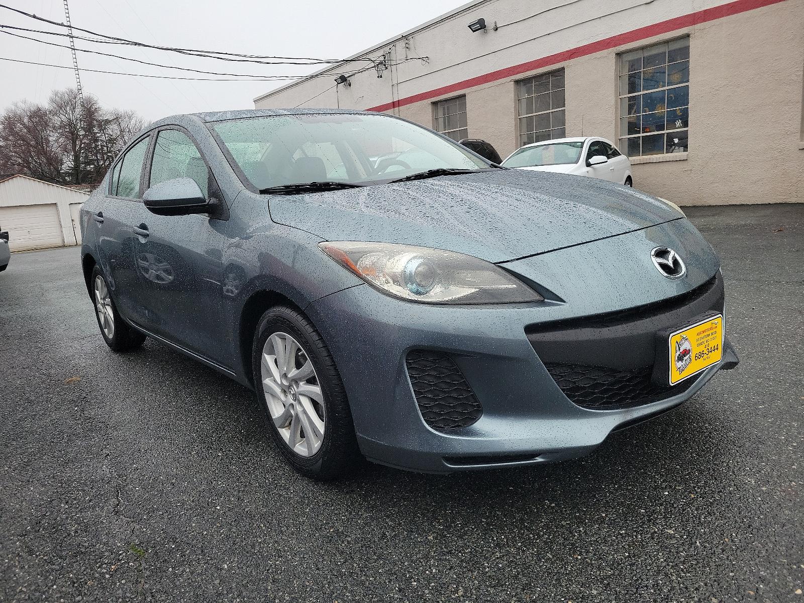 2012 Dolphin Gray Mica - 39T /Black - BU4 Mazda Mazda3 i Grand Touring (JM1BL1W88C1) with an 2.0L DOHC 16-valve SKYACTIV-G I4 engine -inc: variable valve timing (VVT) engine, located at 50 Eastern Blvd., Essex, MD, 21221, (410) 686-3444, 39.304367, -76.484947 - Discover the thrilling ride of the 2012 Mazda Mazda3 i Grand Touring 4dr Sedan Auto i Grand Touring. This vehicle showcases a sleek Dolphin Gray Mica-39T exterior, elegantly complemented by a sophisticated Black-BU4 interior that underlines its timeless appeal. Under the hood, you'll find the robust - Photo #2
