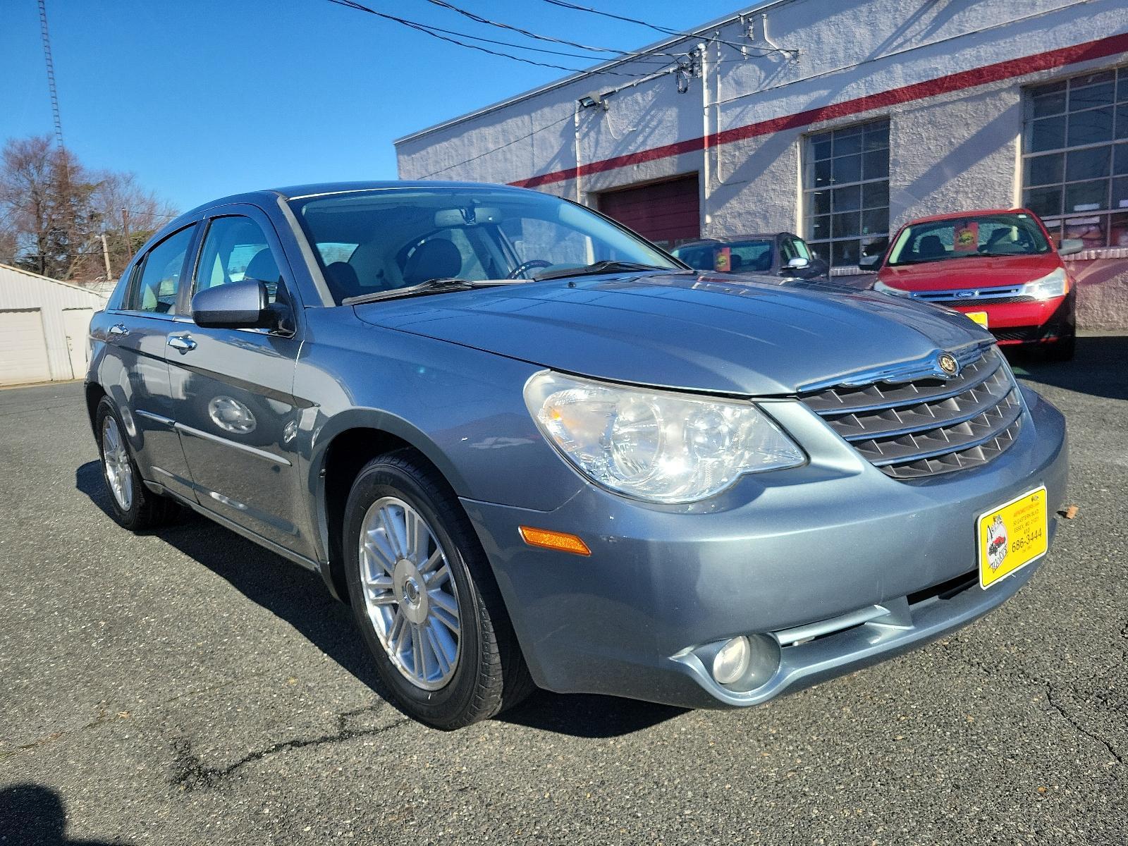 2007 Silver Steel Metallic - PA4 /Dark/Light Slate Gray - DB Chrysler Sebring Sdn Limited (1C3LC66K57N) with an 2.4L SMPI DOHC 16-VALVE I4 DUAL VVT ENGINE engine, located at 50 Eastern Blvd., Essex, MD, 21221, (410) 686-3444, 39.304367, -76.484947 - Discover the perfect blend of style, comfort and performance with this 2007 Chrysler Sebring Sdn Limited 4dr. Finished in an alluring Silver Steel Metallic - PA4 exterior paired beautifully with the plush Dark/Light Slate Gray - DB interior, it exhibits a sleek, chic aesthetic that's sure to turn he - Photo #2
