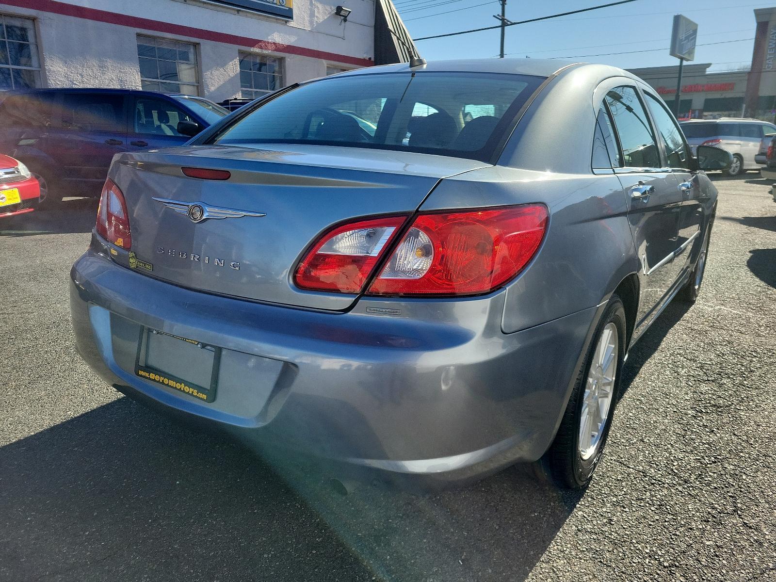 2007 Silver Steel Metallic - PA4 /Dark/Light Slate Gray - DB Chrysler Sebring Sdn Limited (1C3LC66K57N) with an 2.4L SMPI DOHC 16-VALVE I4 DUAL VVT ENGINE engine, located at 50 Eastern Blvd., Essex, MD, 21221, (410) 686-3444, 39.304367, -76.484947 - Discover the perfect blend of style, comfort and performance with this 2007 Chrysler Sebring Sdn Limited 4dr. Finished in an alluring Silver Steel Metallic - PA4 exterior paired beautifully with the plush Dark/Light Slate Gray - DB interior, it exhibits a sleek, chic aesthetic that's sure to turn he - Photo #3