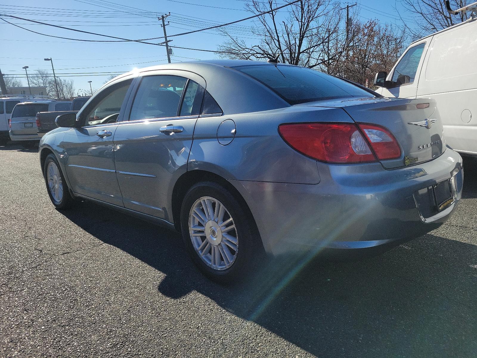 2007 Silver Steel Metallic - PA4 /Dark/Light Slate Gray - DB Chrysler Sebring Sdn Limited (1C3LC66K57N) with an 2.4L SMPI DOHC 16-VALVE I4 DUAL VVT ENGINE engine, located at 50 Eastern Blvd., Essex, MD, 21221, (410) 686-3444, 39.304367, -76.484947 - Discover the perfect blend of style, comfort and performance with this 2007 Chrysler Sebring Sdn Limited 4dr. Finished in an alluring Silver Steel Metallic - PA4 exterior paired beautifully with the plush Dark/Light Slate Gray - DB interior, it exhibits a sleek, chic aesthetic that's sure to turn he - Photo #5