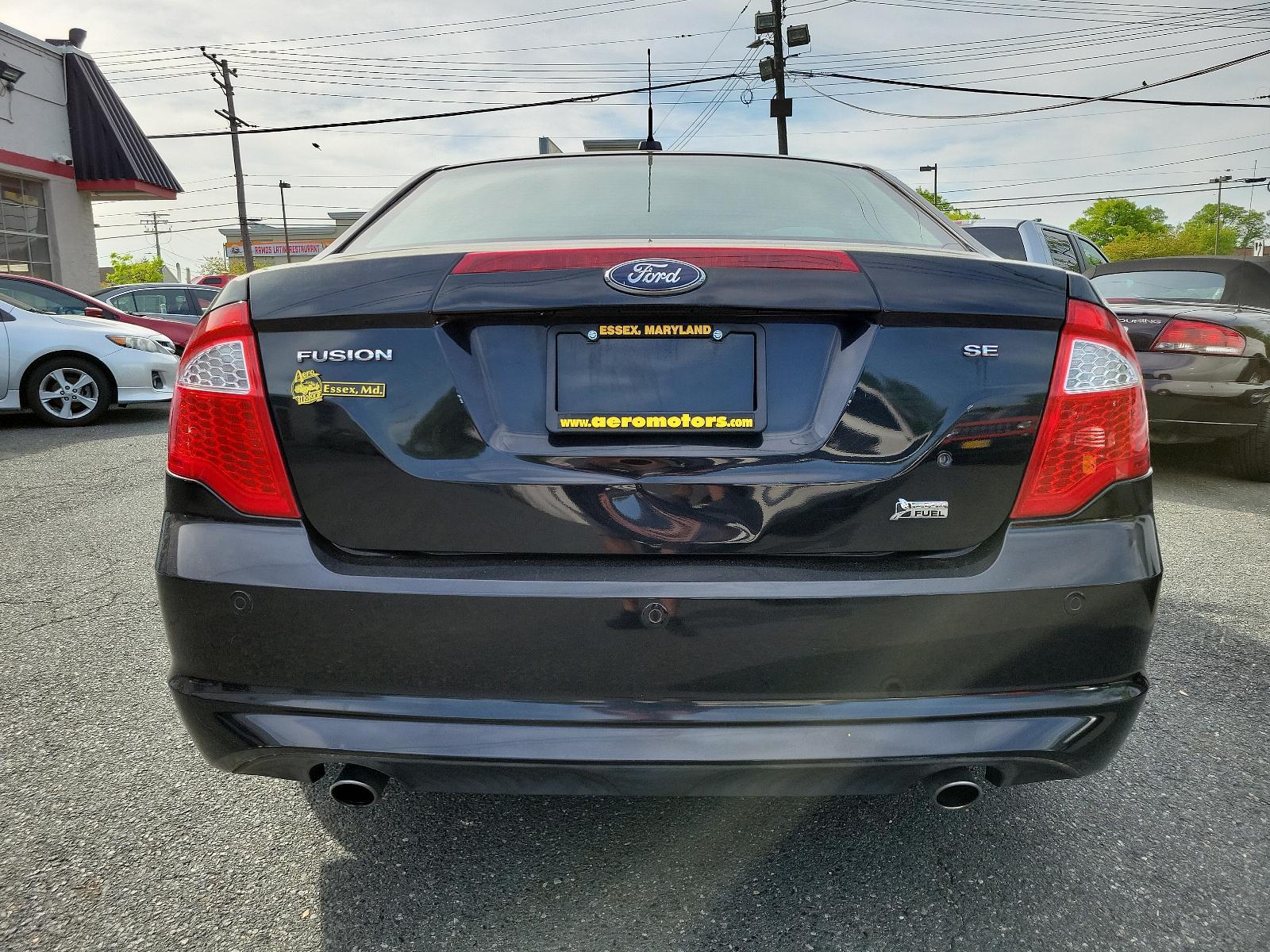 2010 Tuxedo Black Metallic - UH /Medium Light Stone - DL Ford Fusion SE (3FAHP0HG1AR) with an 3.0L 24V V6 DURATEC FLEX FUEL ENGINE engine, located at 50 Eastern Blvd., Essex, MD, 21221, (410) 686-3444, 39.304367, -76.484947 - Experience the perfect blend of style, comfort, and performance with this impeccable 2010 Ford Fusion SE Sedan. Showcased in sophisticated Tuxedo Black Metallic paintwork, this 4-door delight boasts a Medium Light Stone interior that promotes a sophisticated environment. Under the hood, you'll disco - Photo #4