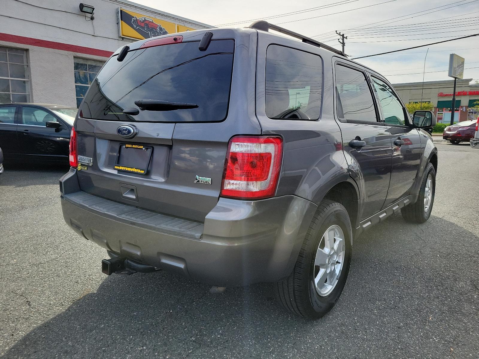 2011 Sterling Grey Metallic - UJ /Stone - 5S Ford Escape XLT (1FMCU0DGXBK) with an 3.0L V6 FLEX FUEL ENGINE engine, located at 50 Eastern Blvd., Essex, MD, 21221, (410) 686-3444, 39.304367, -76.484947 - Discover the captivating blend of style and performance that defines this 2011 Ford Escape XLT. Its power comes from a 3.0L V6 Flex Fuel engine, ensuring robust performance anytime you hit the road. From the exterior to the interior, this vehicle's design is truly a sight to behold. Coated in a stri - Photo #3