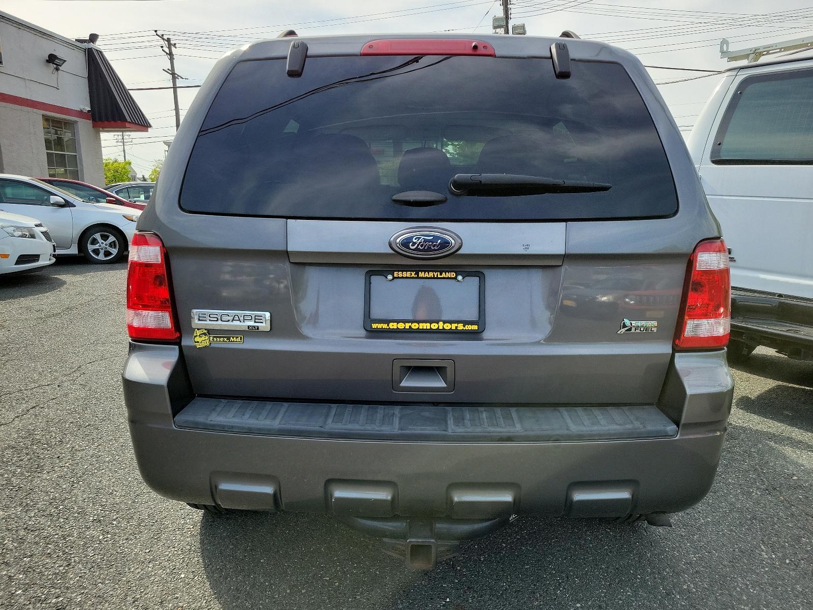2011 Sterling Grey Metallic - UJ /Stone - 5S Ford Escape XLT (1FMCU0DGXBK) with an 3.0L V6 FLEX FUEL ENGINE engine, located at 50 Eastern Blvd., Essex, MD, 21221, (410) 686-3444, 39.304367, -76.484947 - Discover the captivating blend of style and performance that defines this 2011 Ford Escape XLT. Its power comes from a 3.0L V6 Flex Fuel engine, ensuring robust performance anytime you hit the road. From the exterior to the interior, this vehicle's design is truly a sight to behold. Coated in a stri - Photo #4