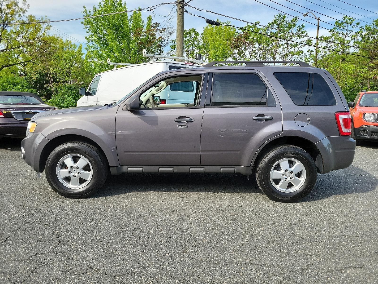 2011 Sterling Grey Metallic - UJ /Stone - 5S Ford Escape XLT (1FMCU0DGXBK) with an 3.0L V6 FLEX FUEL ENGINE engine, located at 50 Eastern Blvd., Essex, MD, 21221, (410) 686-3444, 39.304367, -76.484947 - Discover the captivating blend of style and performance that defines this 2011 Ford Escape XLT. Its power comes from a 3.0L V6 Flex Fuel engine, ensuring robust performance anytime you hit the road. From the exterior to the interior, this vehicle's design is truly a sight to behold. Coated in a stri - Photo #6